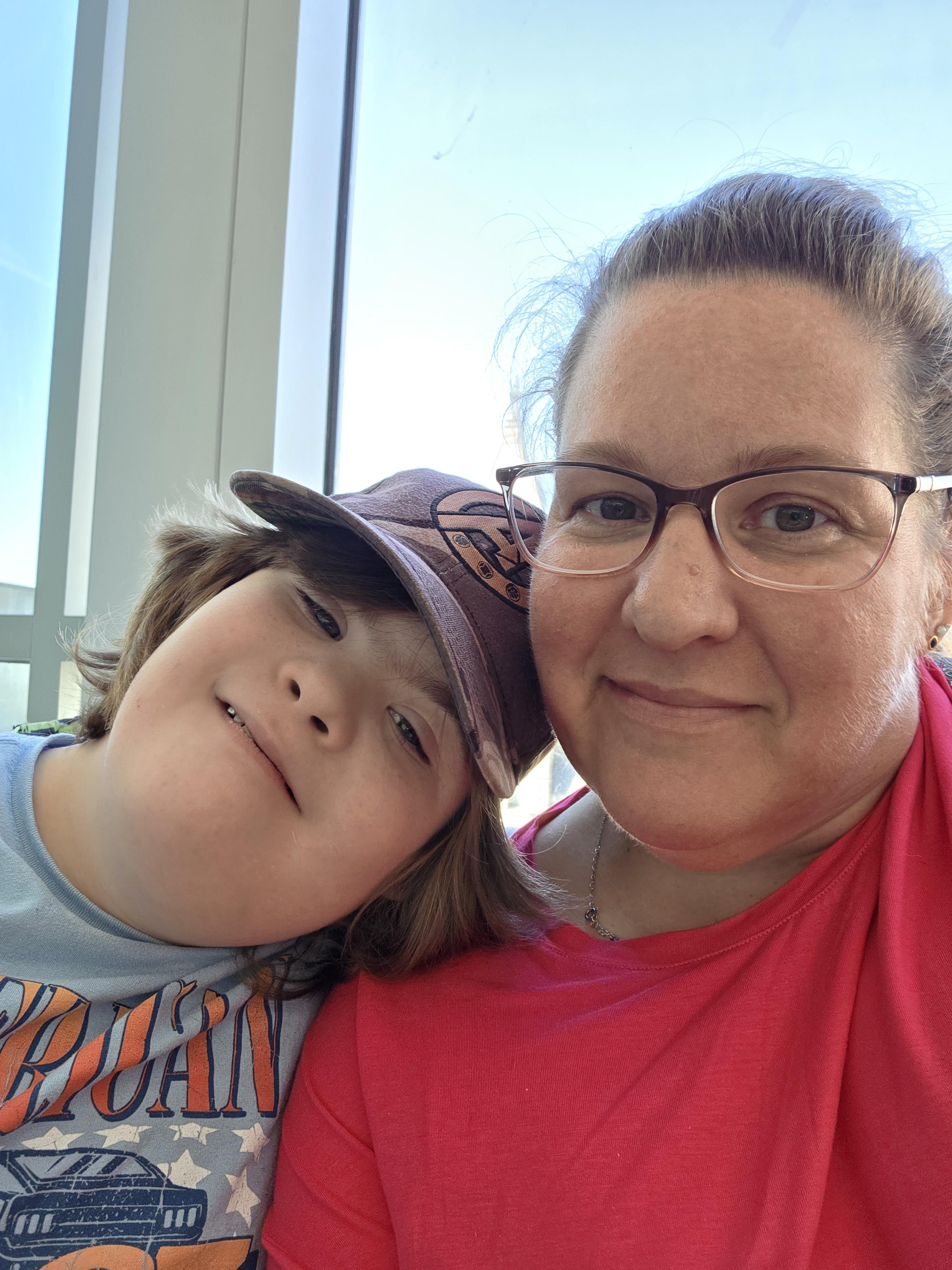 A woman and a boy taking a selfie