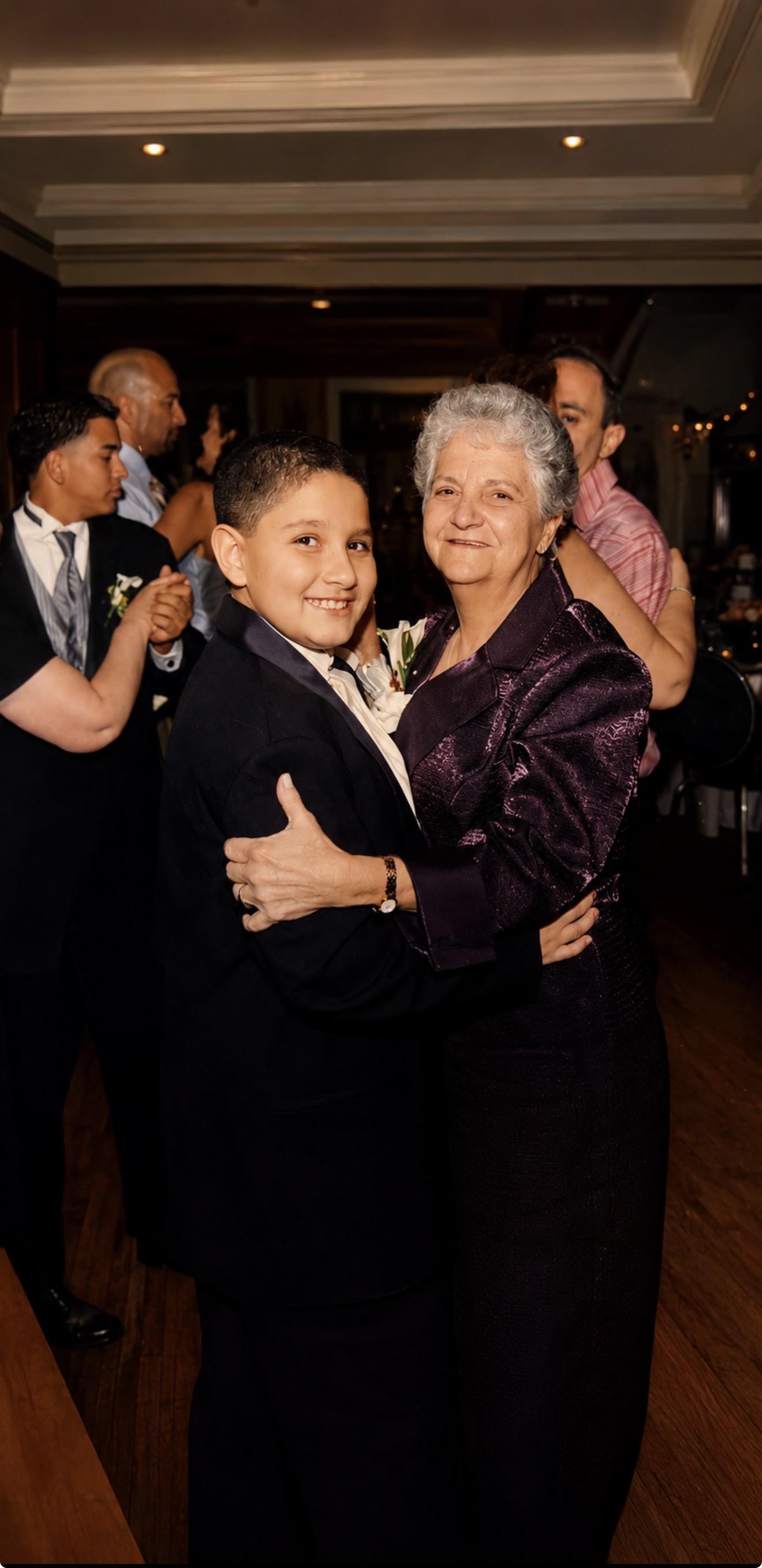 A boy hugging a woman