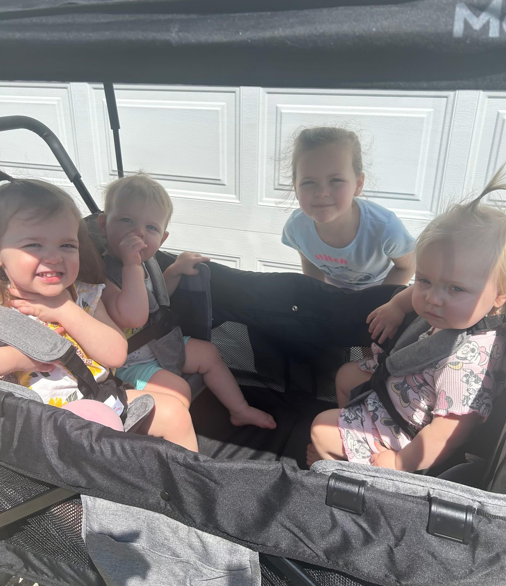 A group of children in a stroller