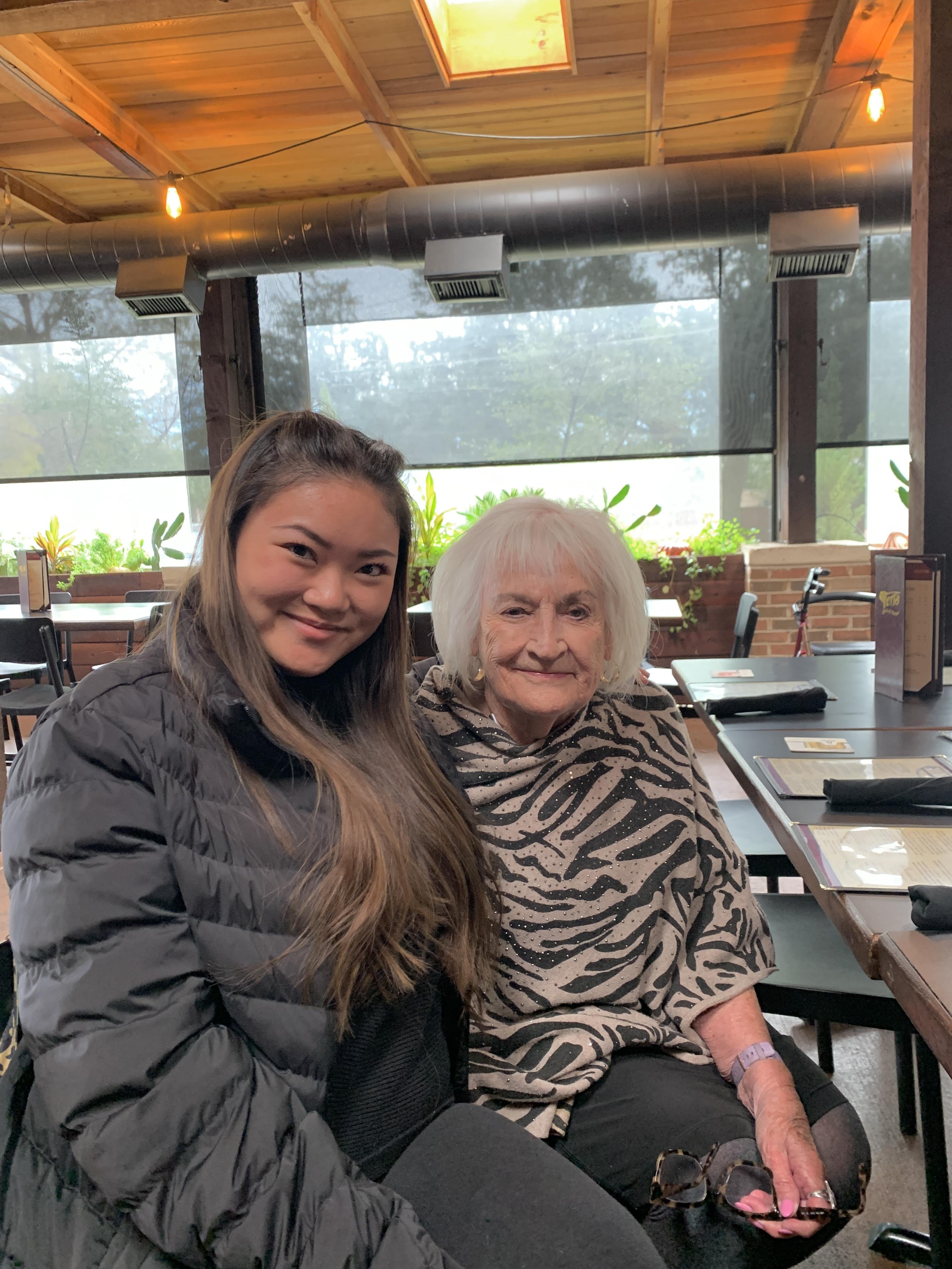 A woman and an older woman sitting at a table