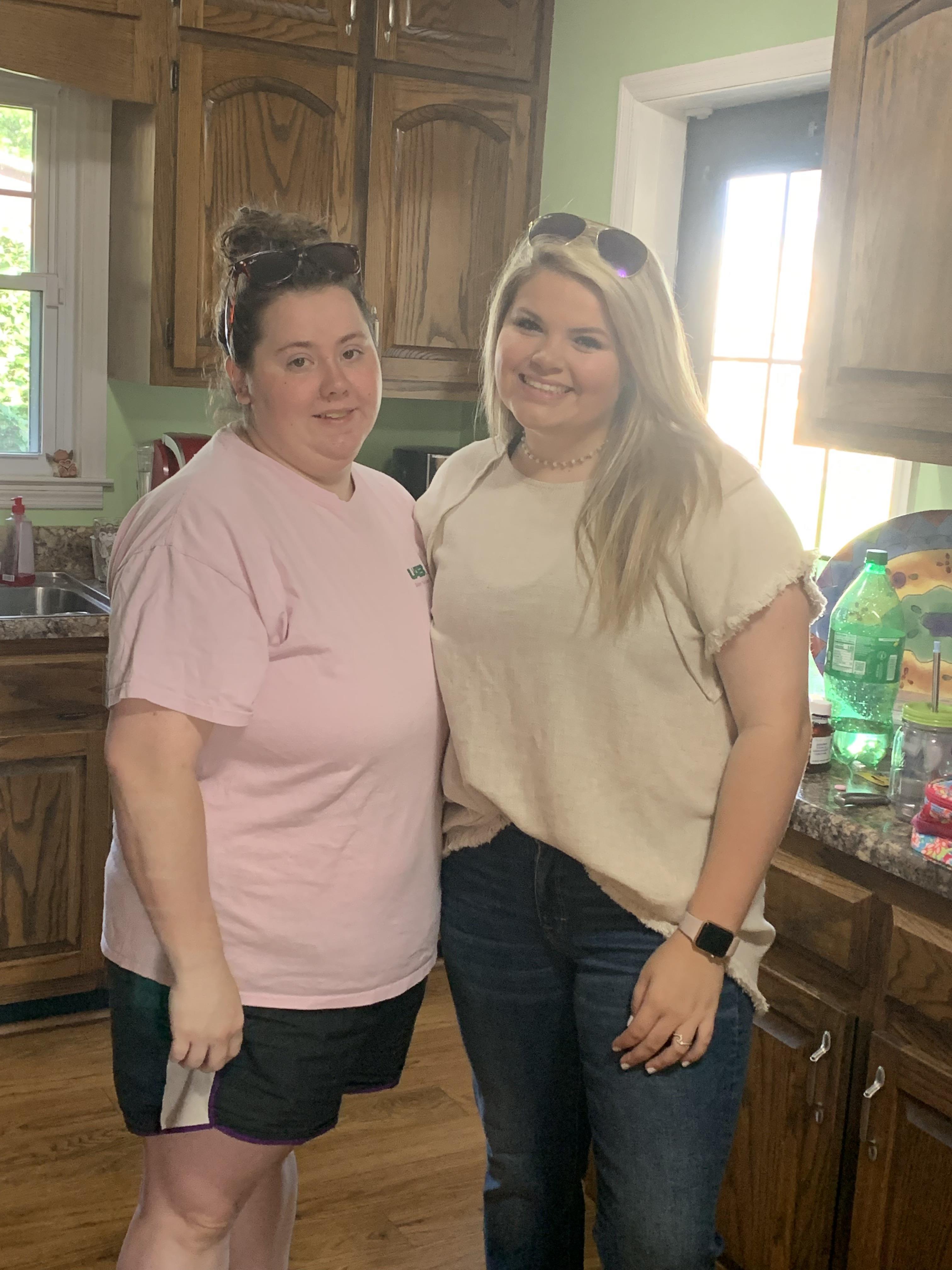 Two women standing in a kitchen
