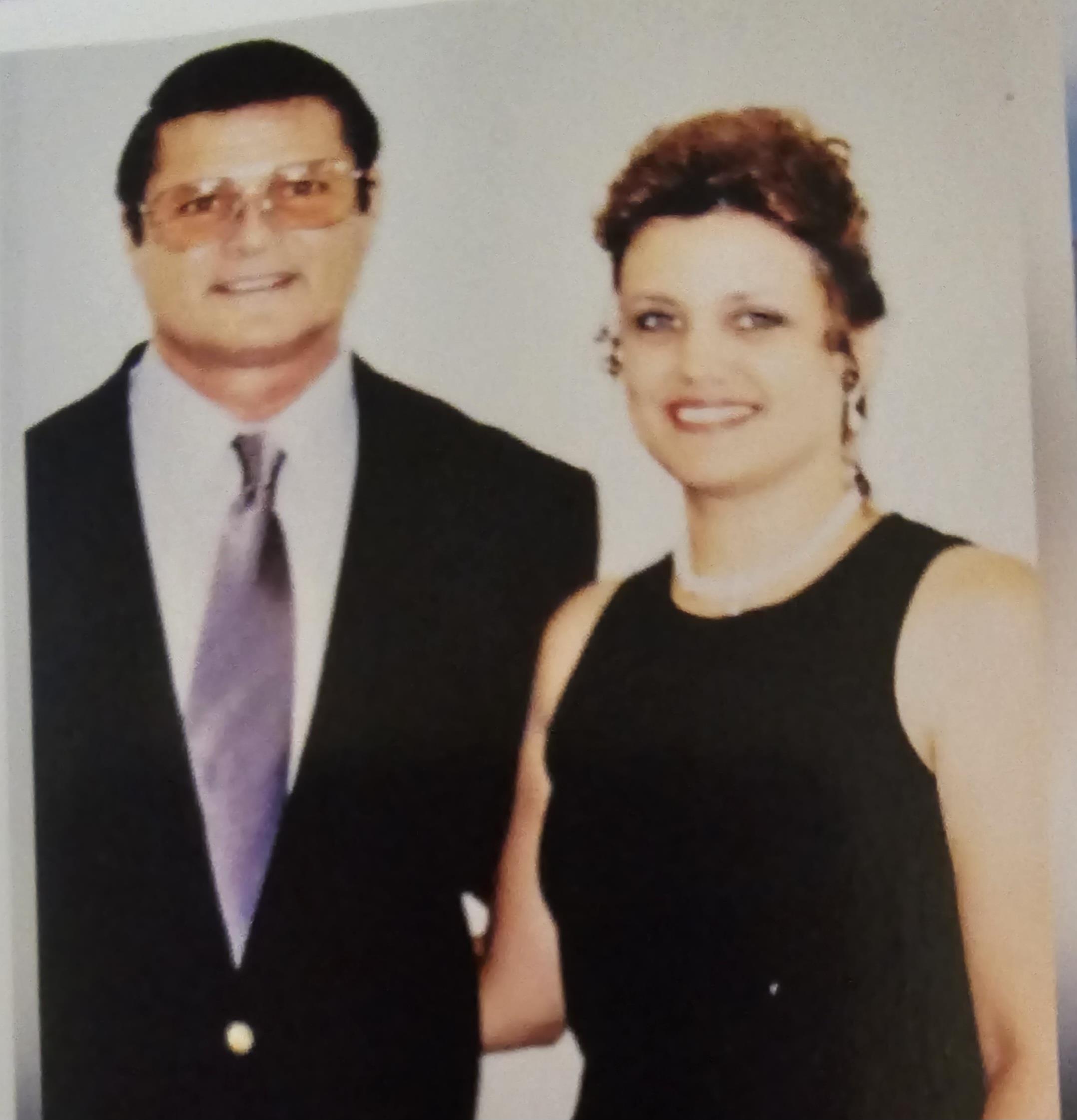 A man and woman posing for a picture