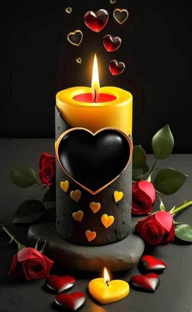 A candle with a heart and roses