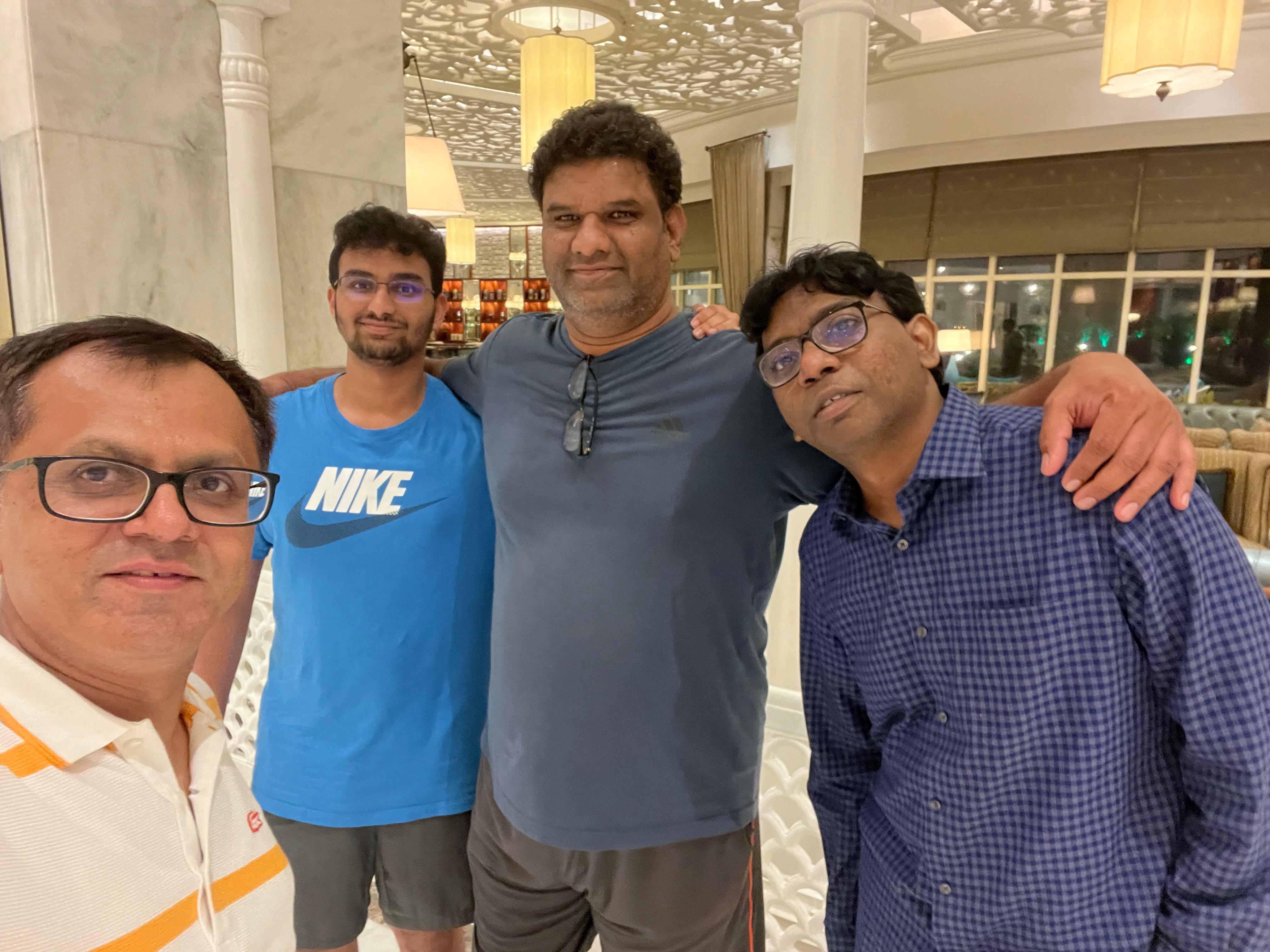 A group of men posing for a photo