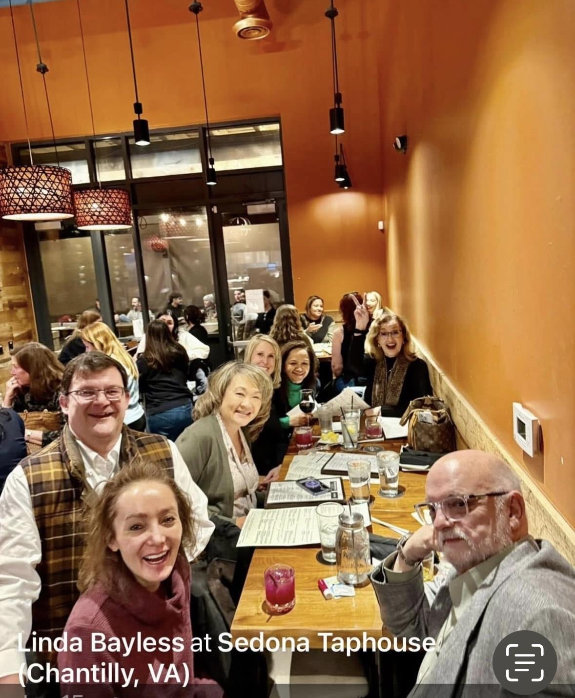 A group of people sitting at a table