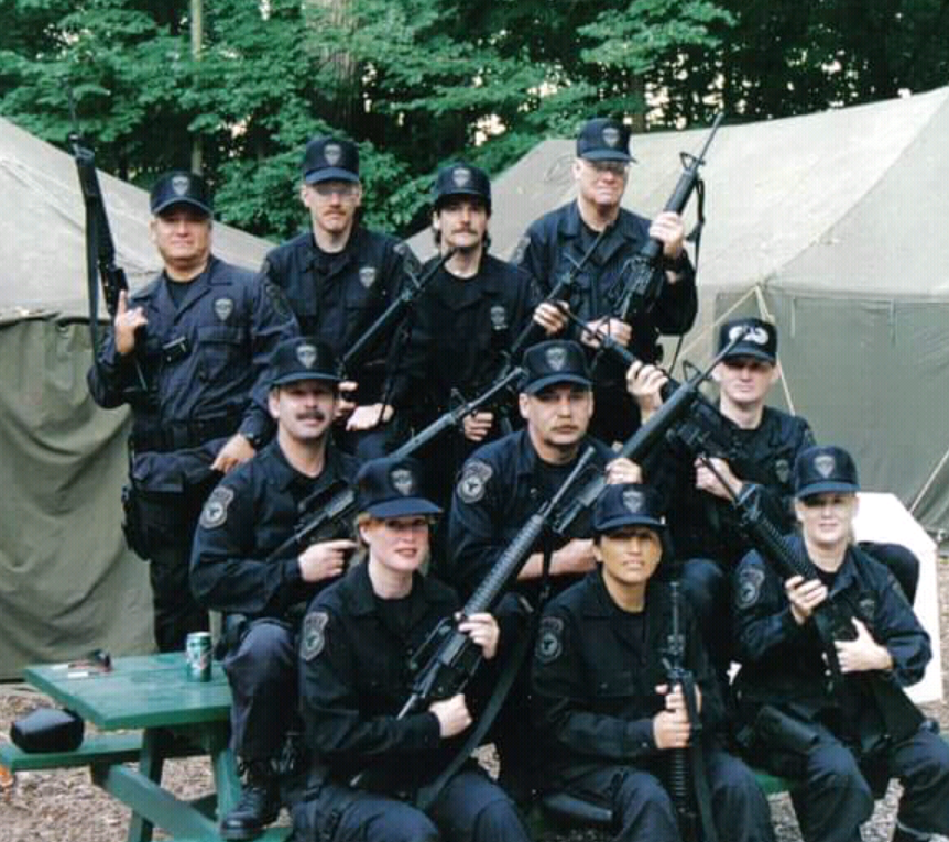 A group of police officers holding guns