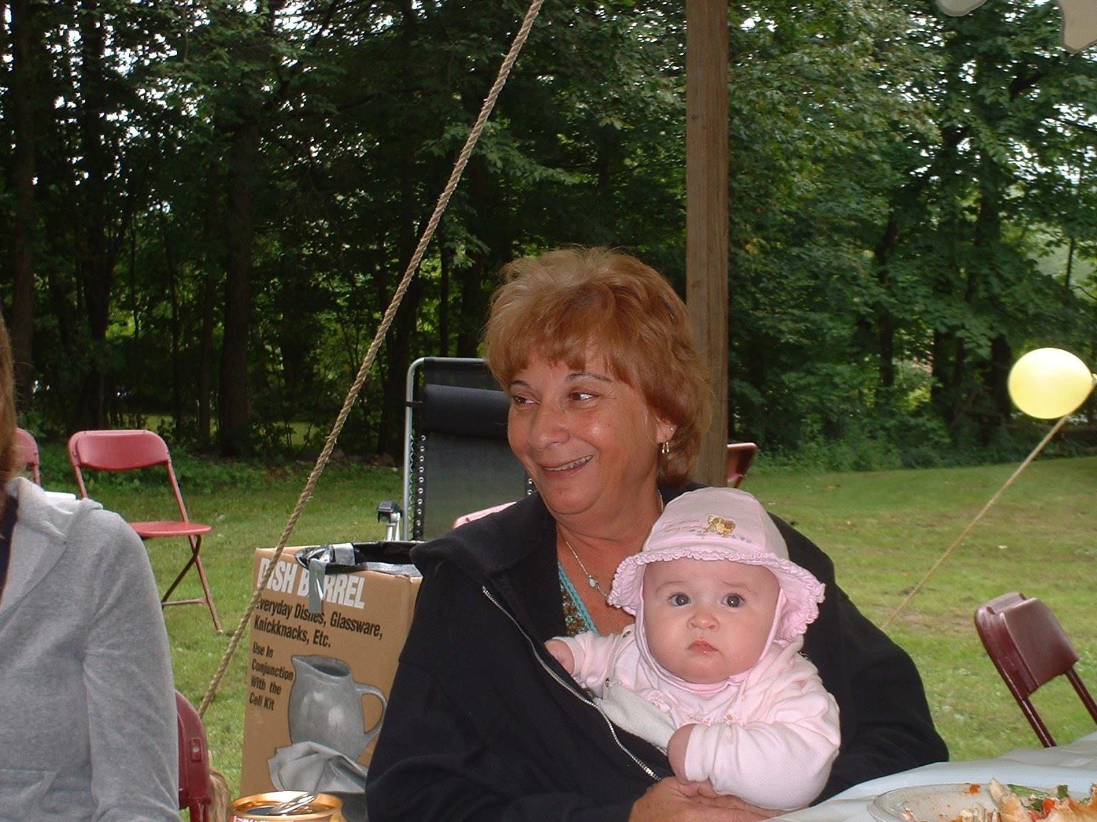 A woman holding a baby