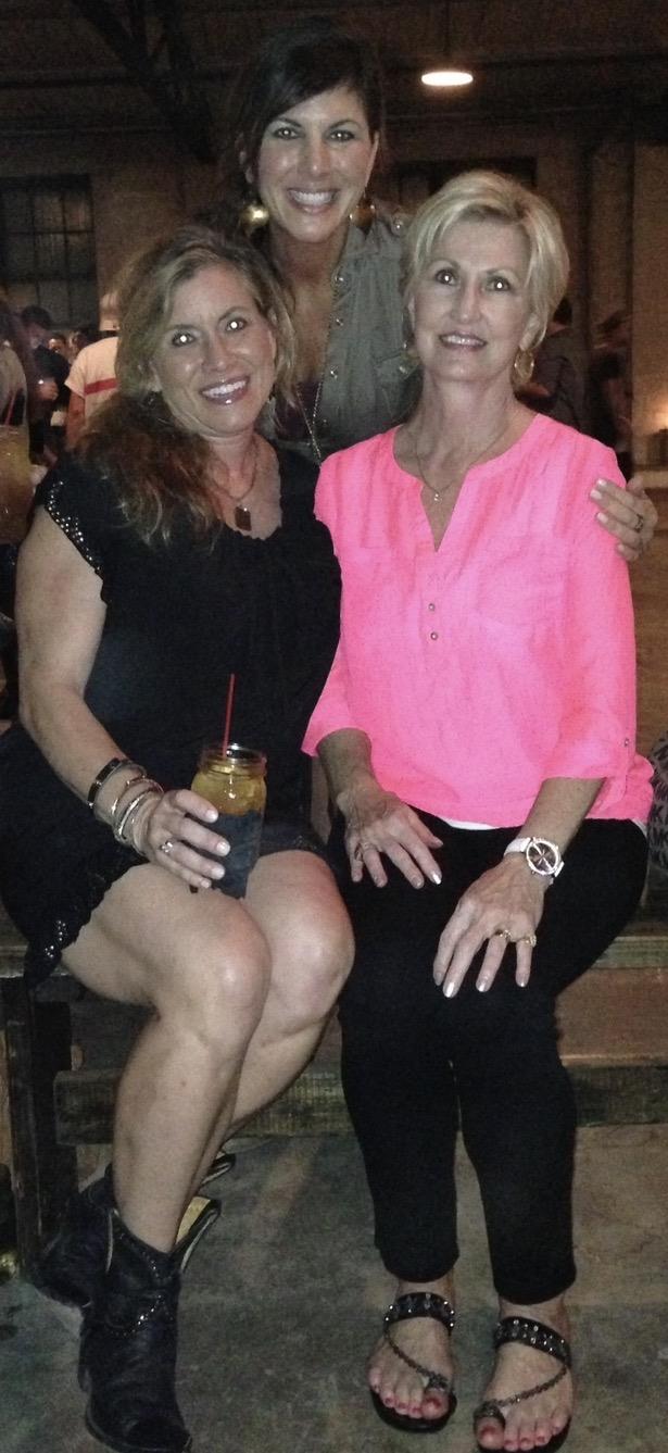 Two women sitting together smiling