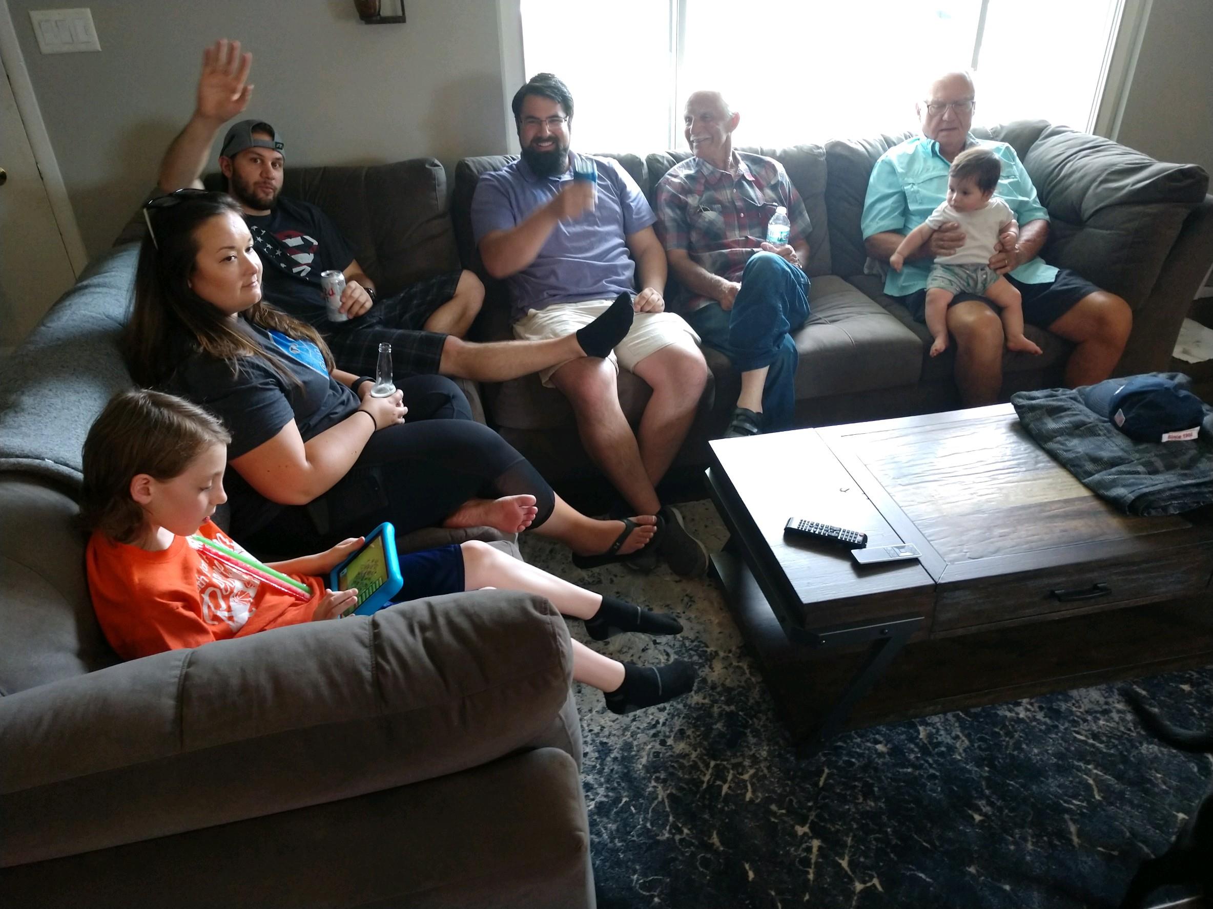 A group of people sitting on a couch