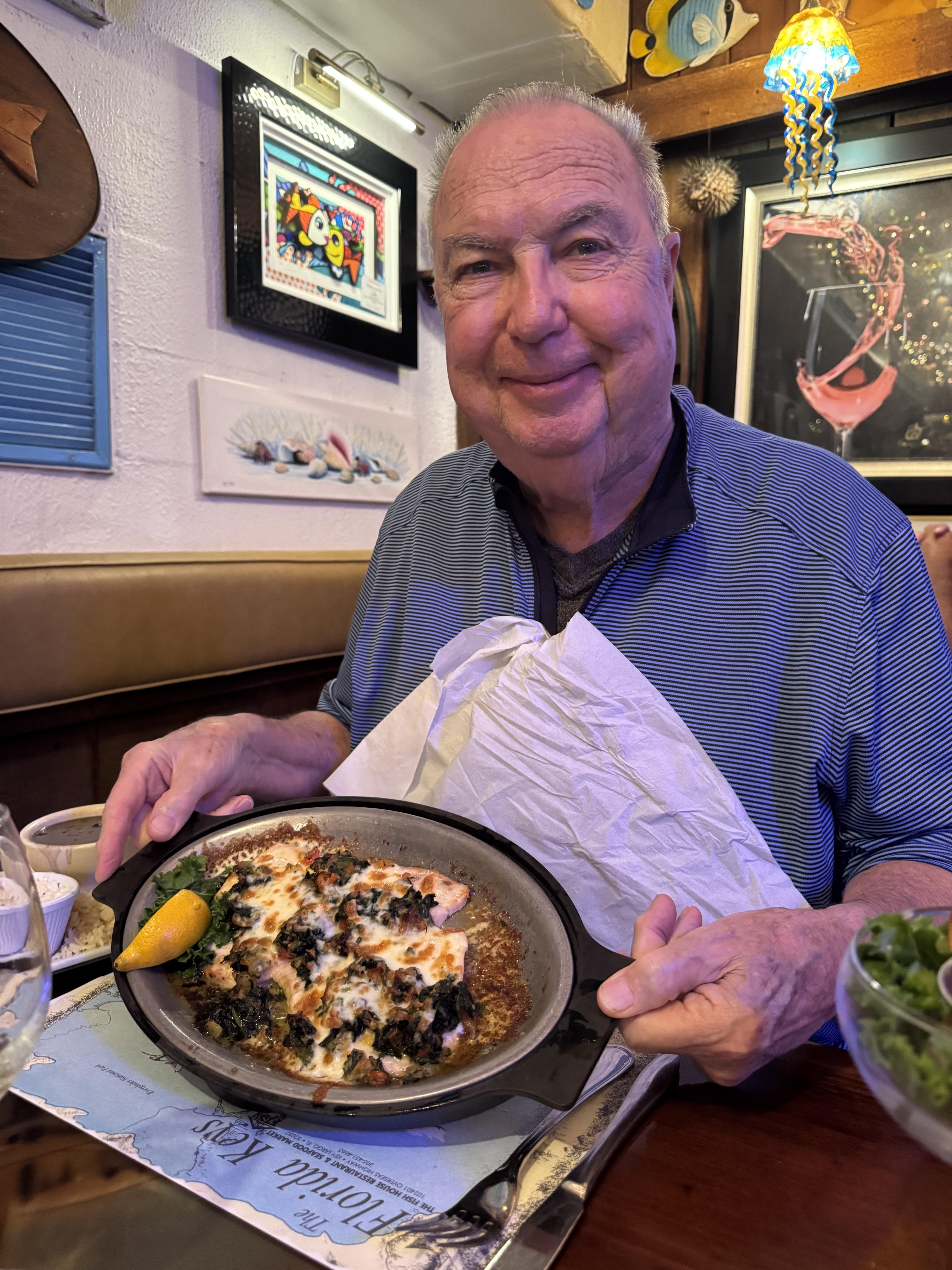 A man holding a plate of food