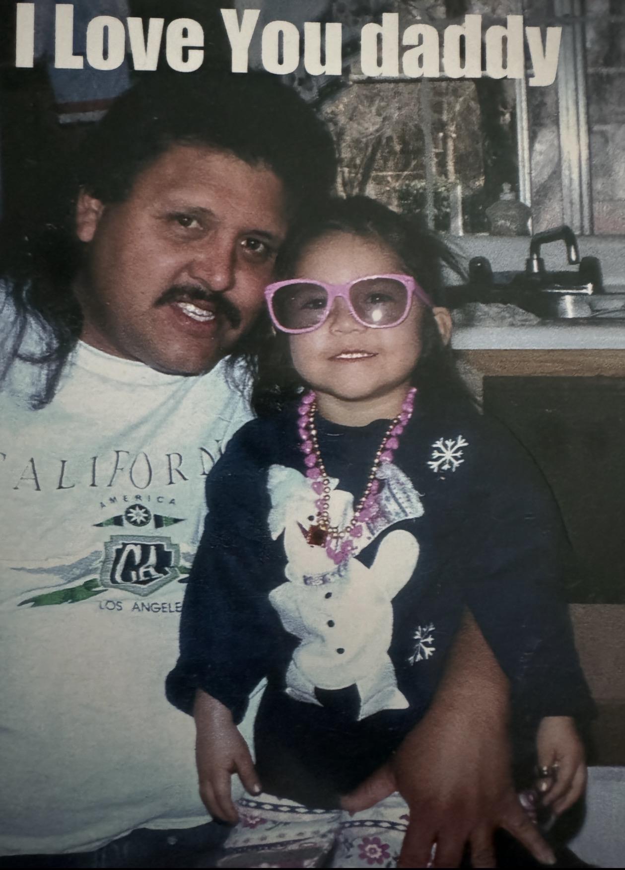 A man and a girl posing for a picture