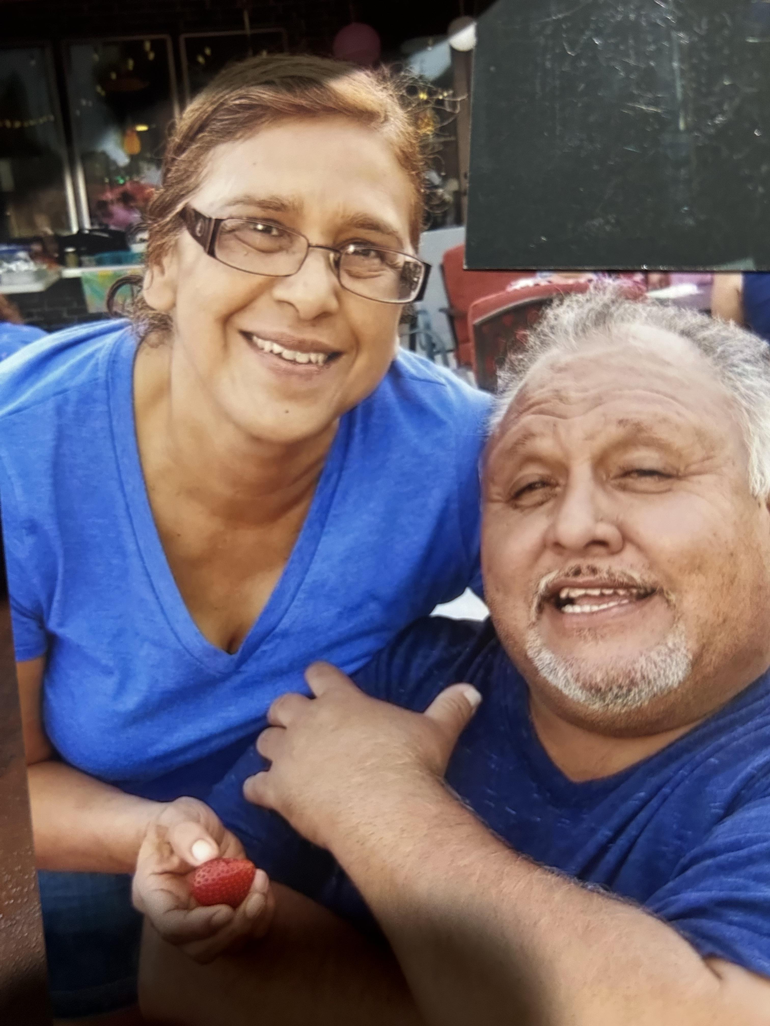 A man and woman smiling for a picture