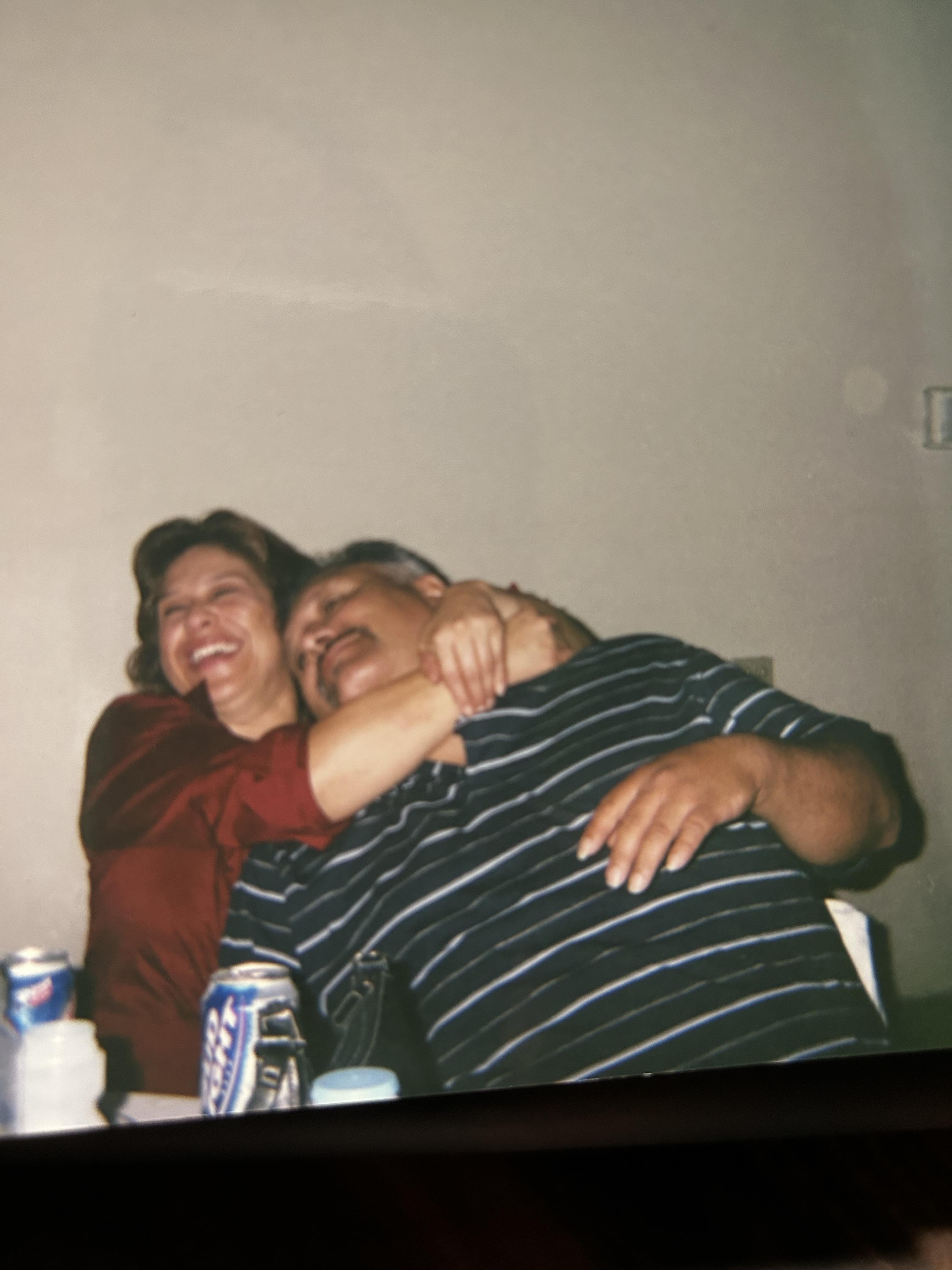 A man and woman hugging each other