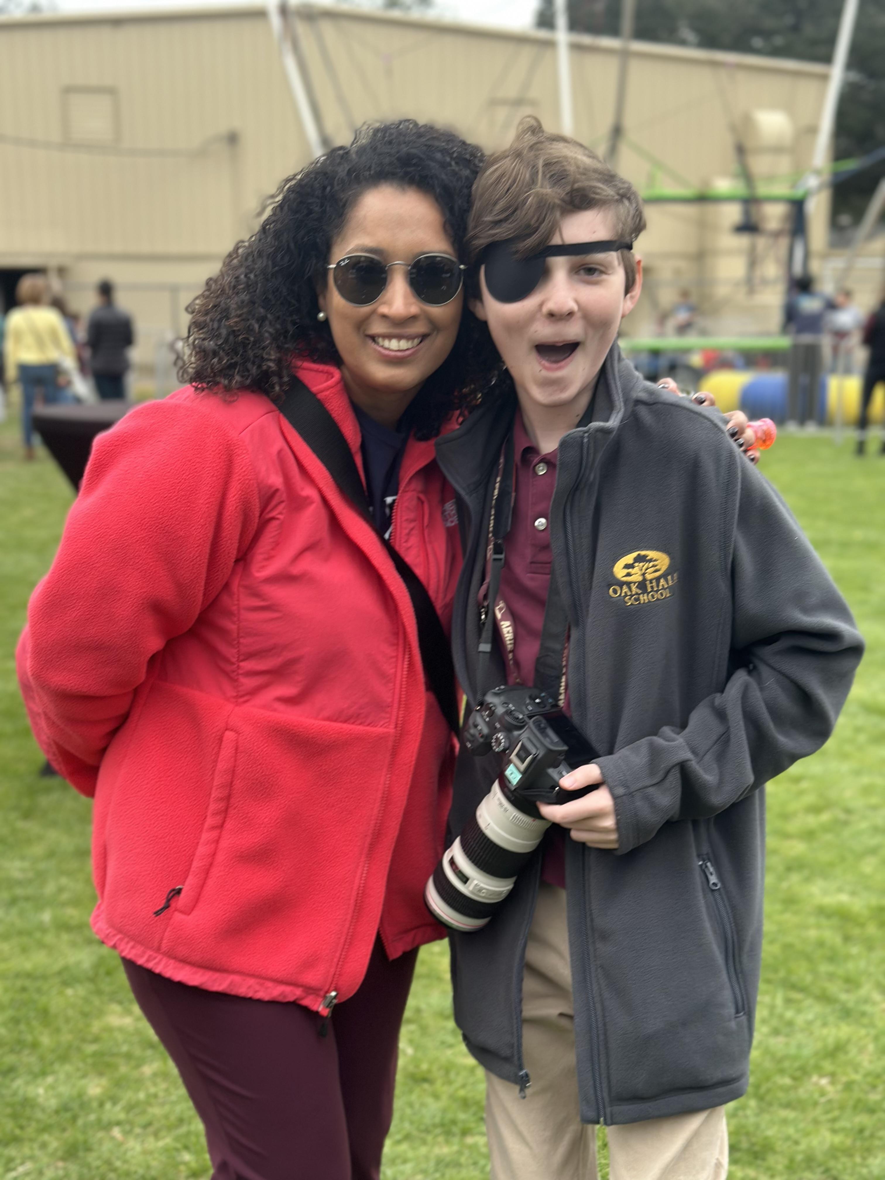 A woman and boy posing for a picture
