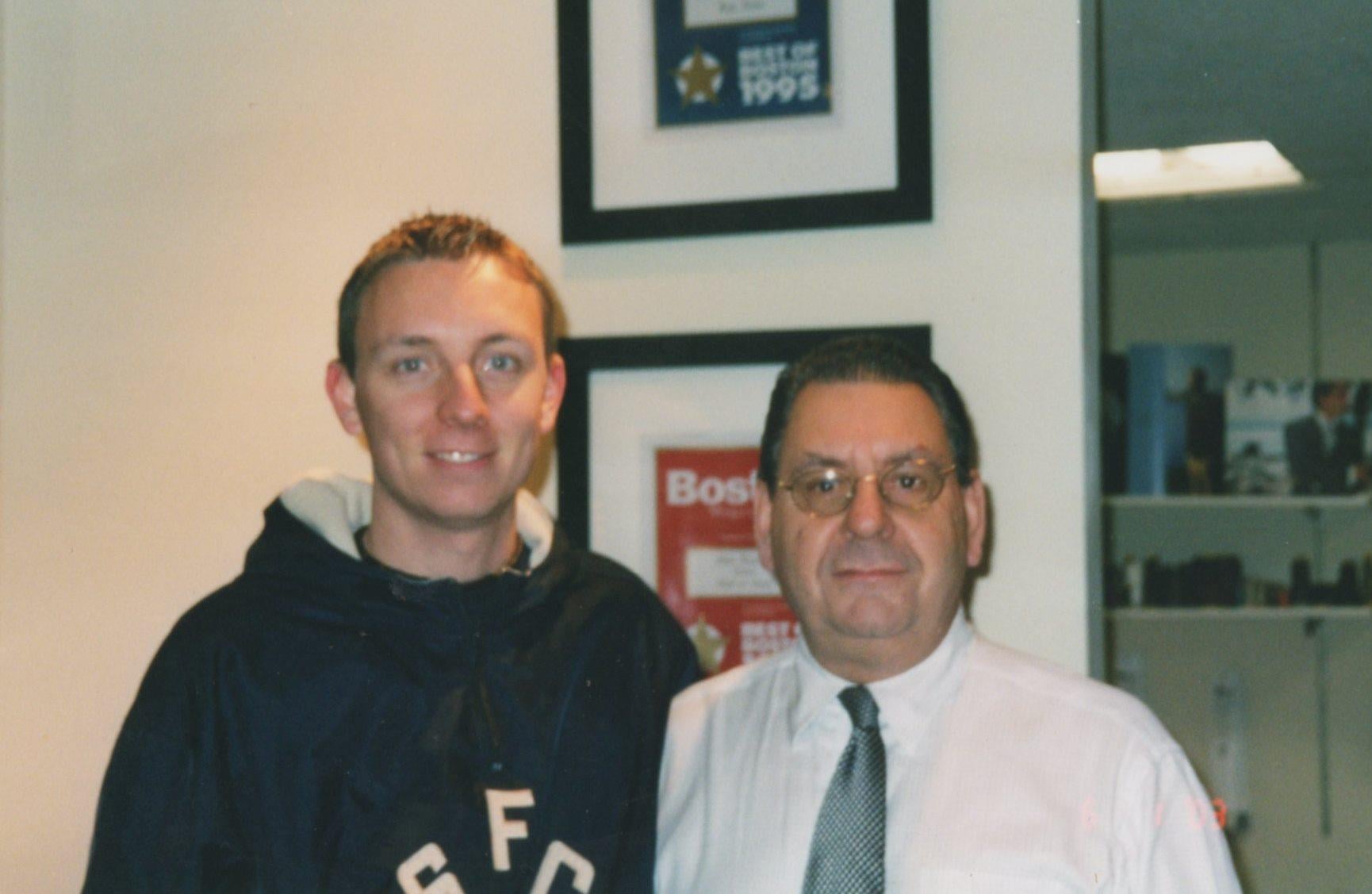 A man and a man posing for a picture