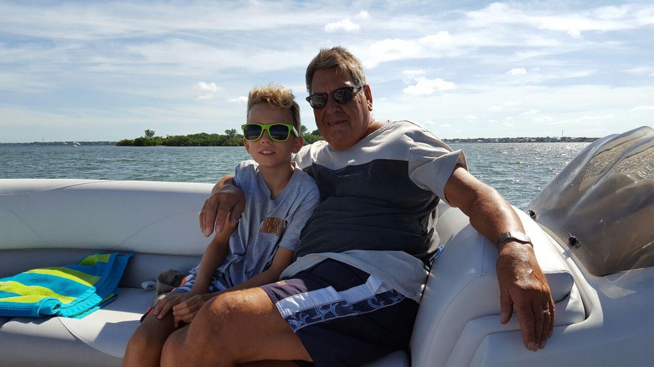 A man and boy sitting on a boat