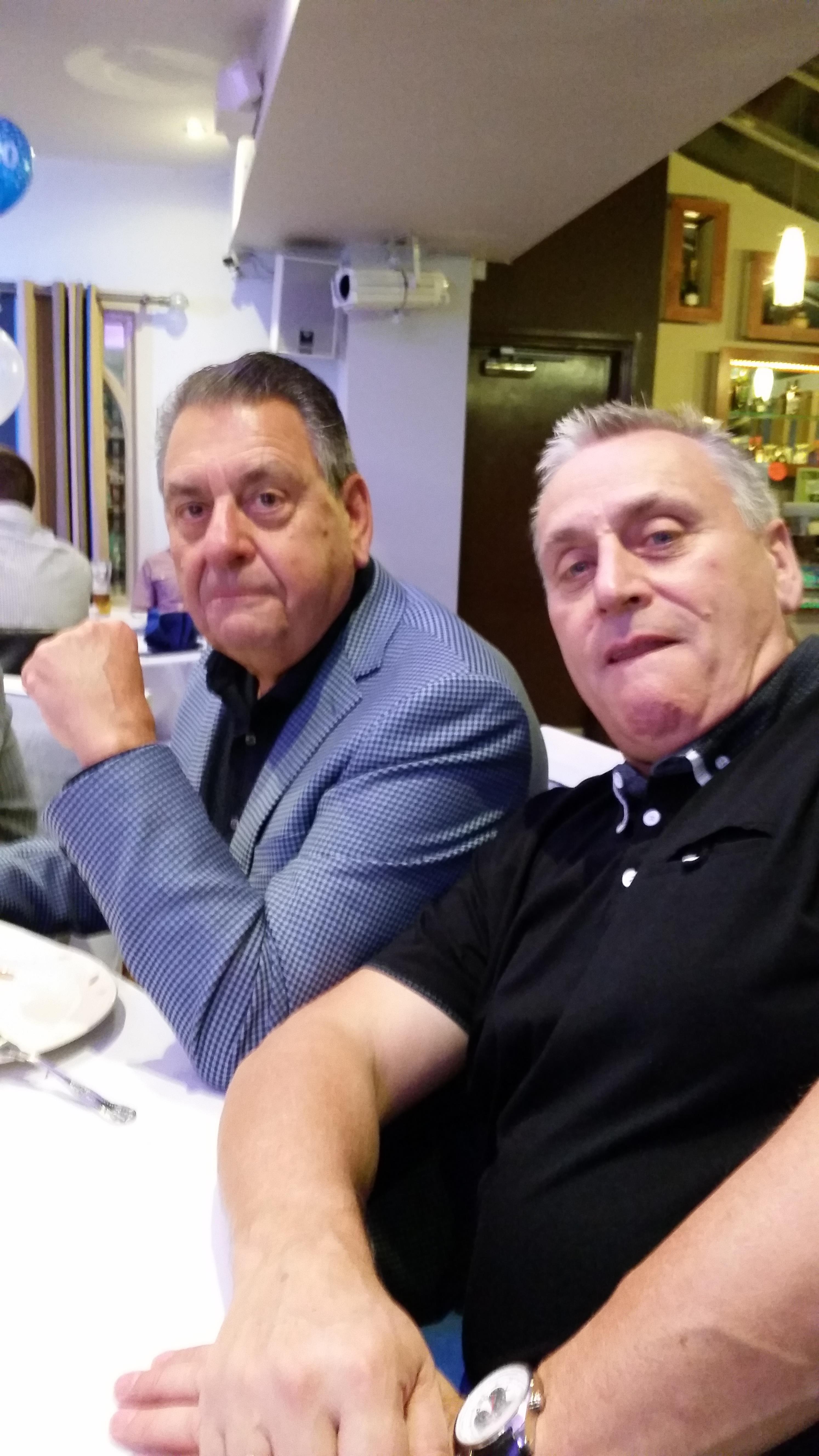 Two men sitting at a table