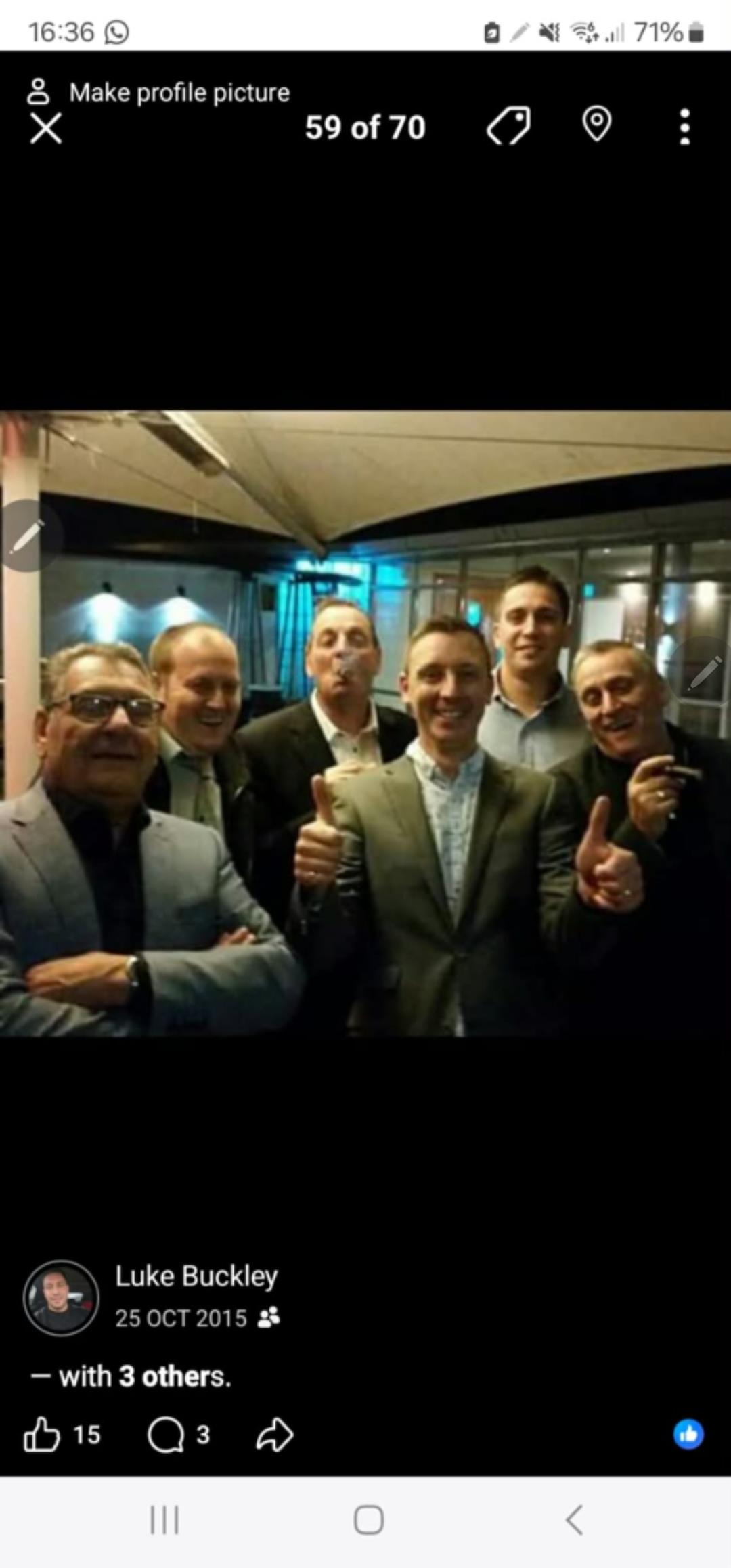 A group of men posing for a photo