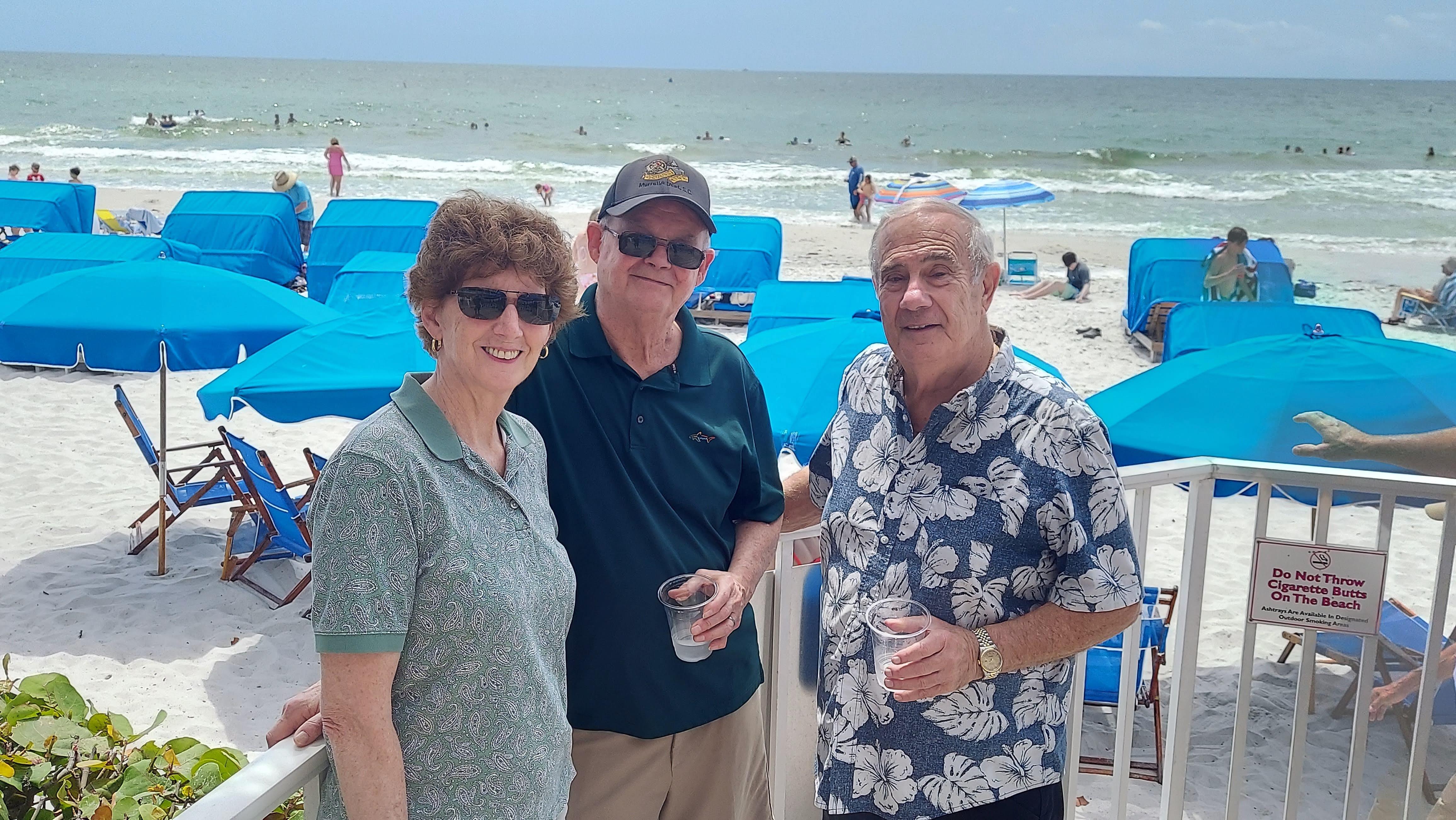 A group of people standing on a beach