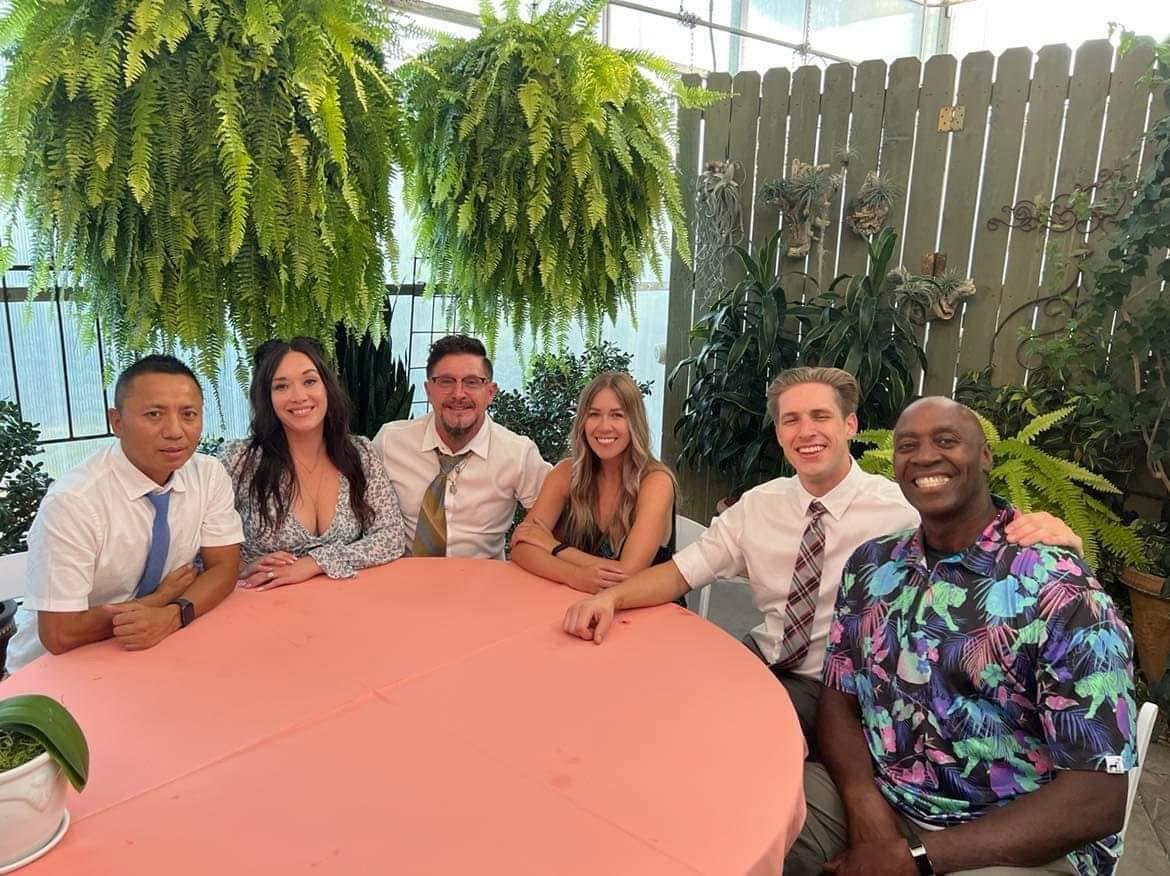 A group of people sitting at a table