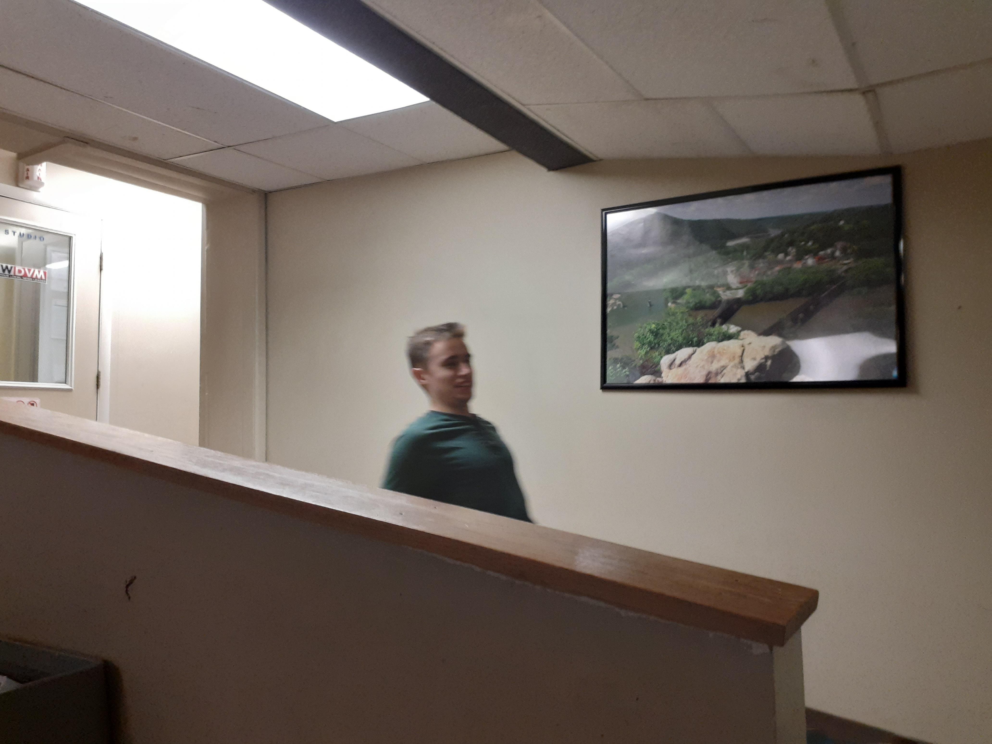 A man standing in a hallway