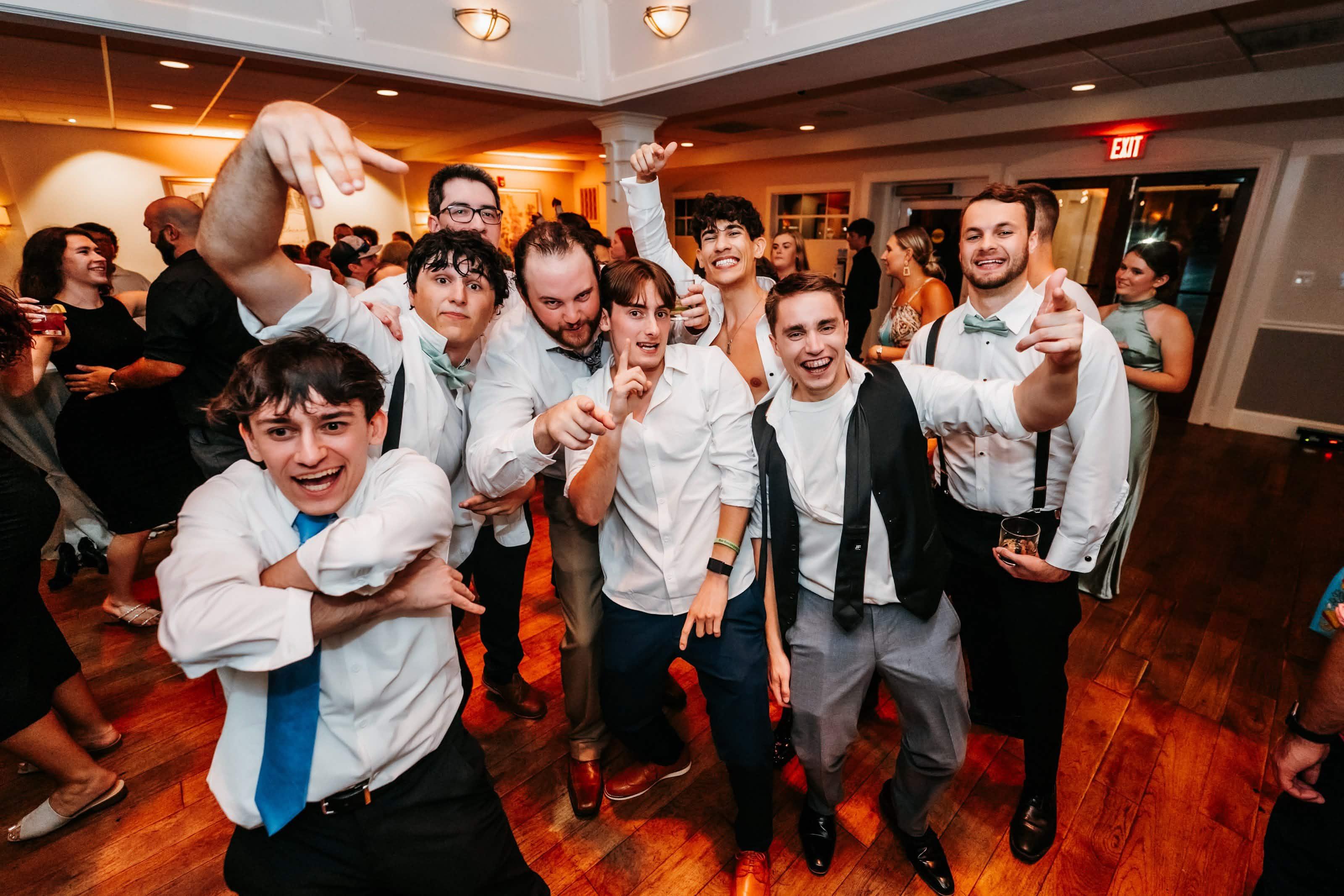A group of men in white shirts
