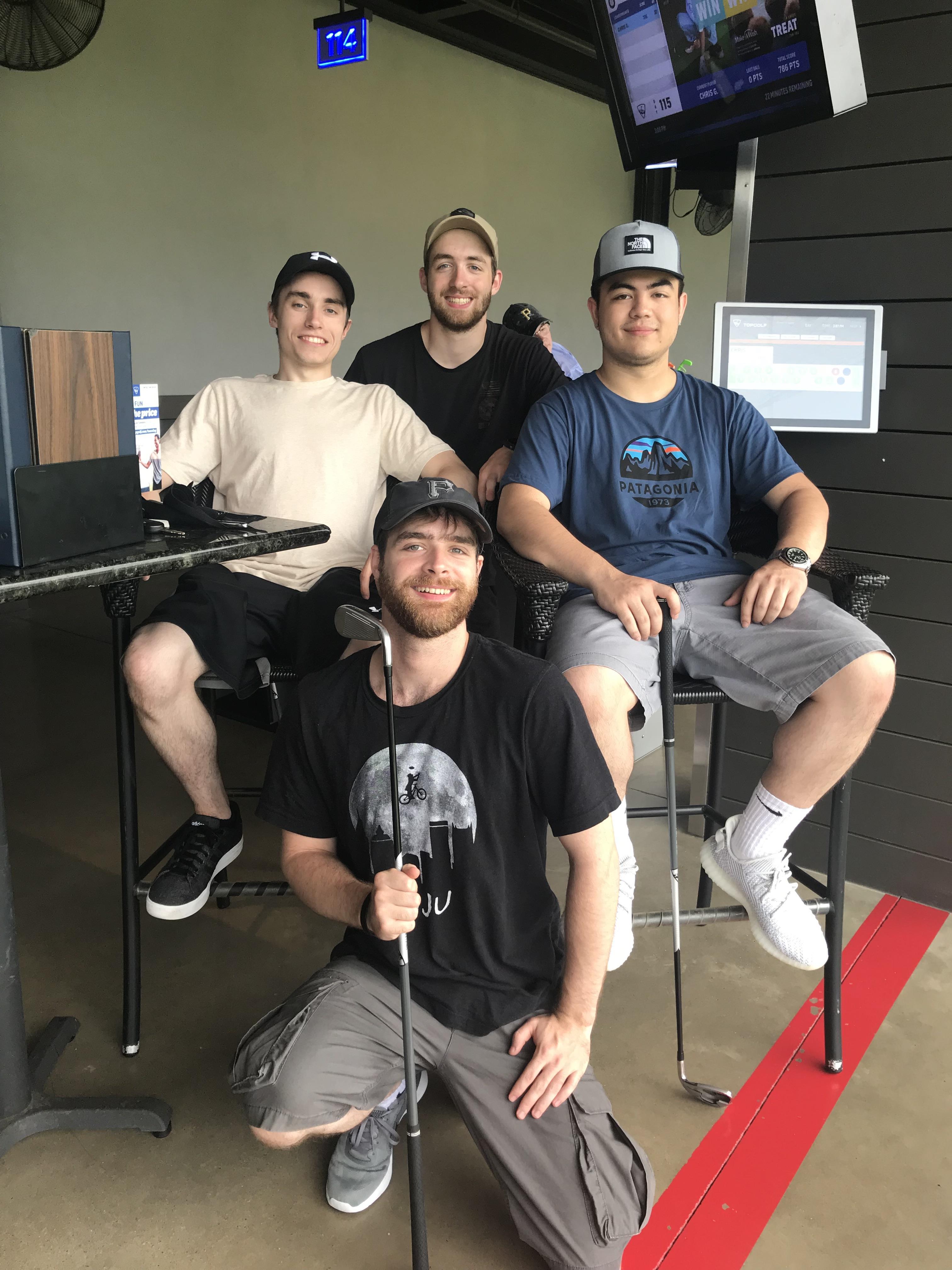 A group of men sitting in chairs