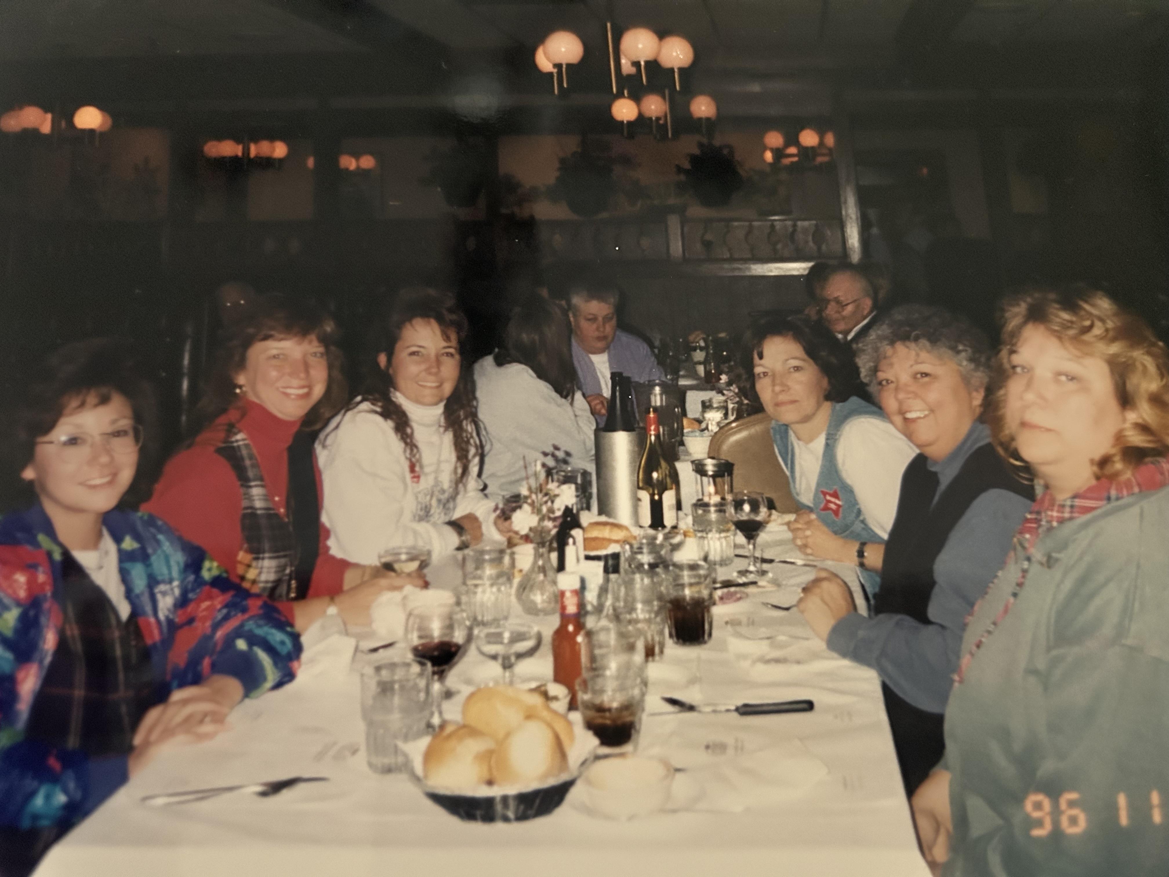 A group of people sitting around a table