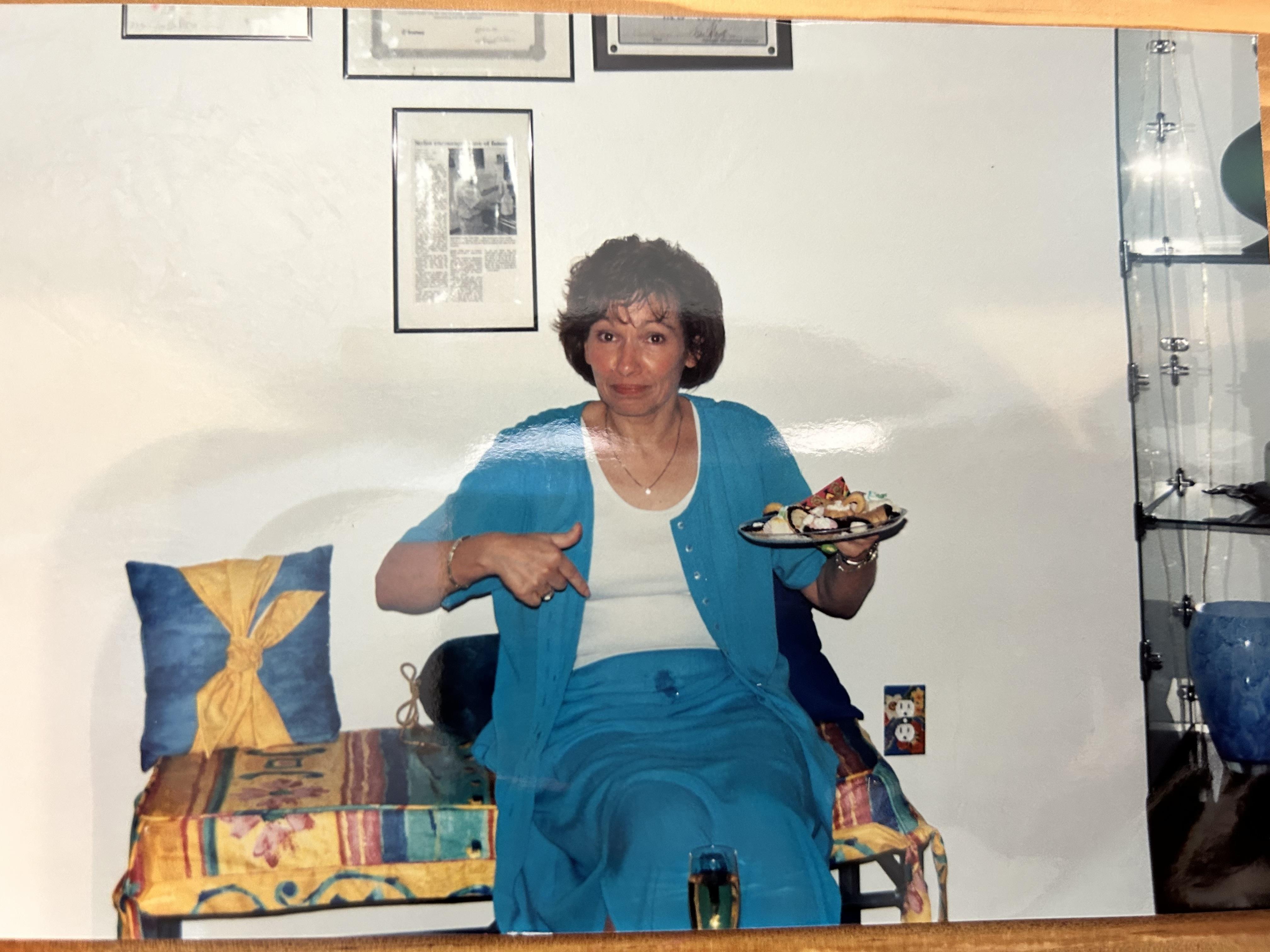 A woman pointing at a plate of food