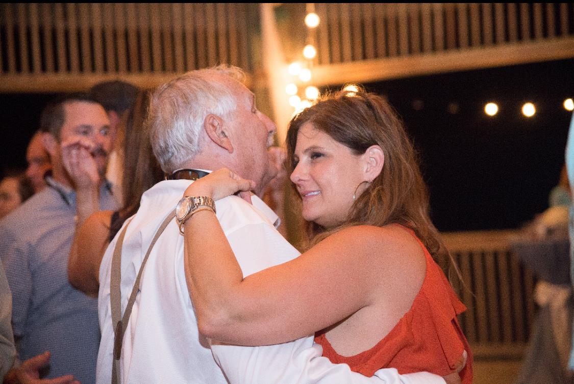 A woman hugging a man