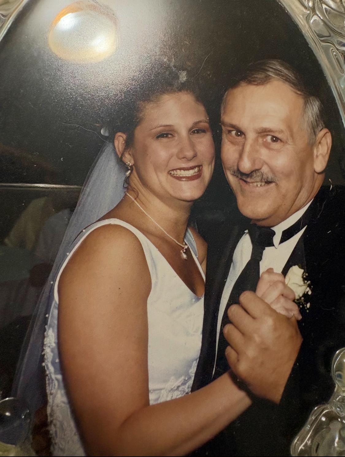 A man and woman posing for a picture