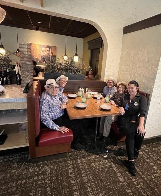 A group of people sitting at a table