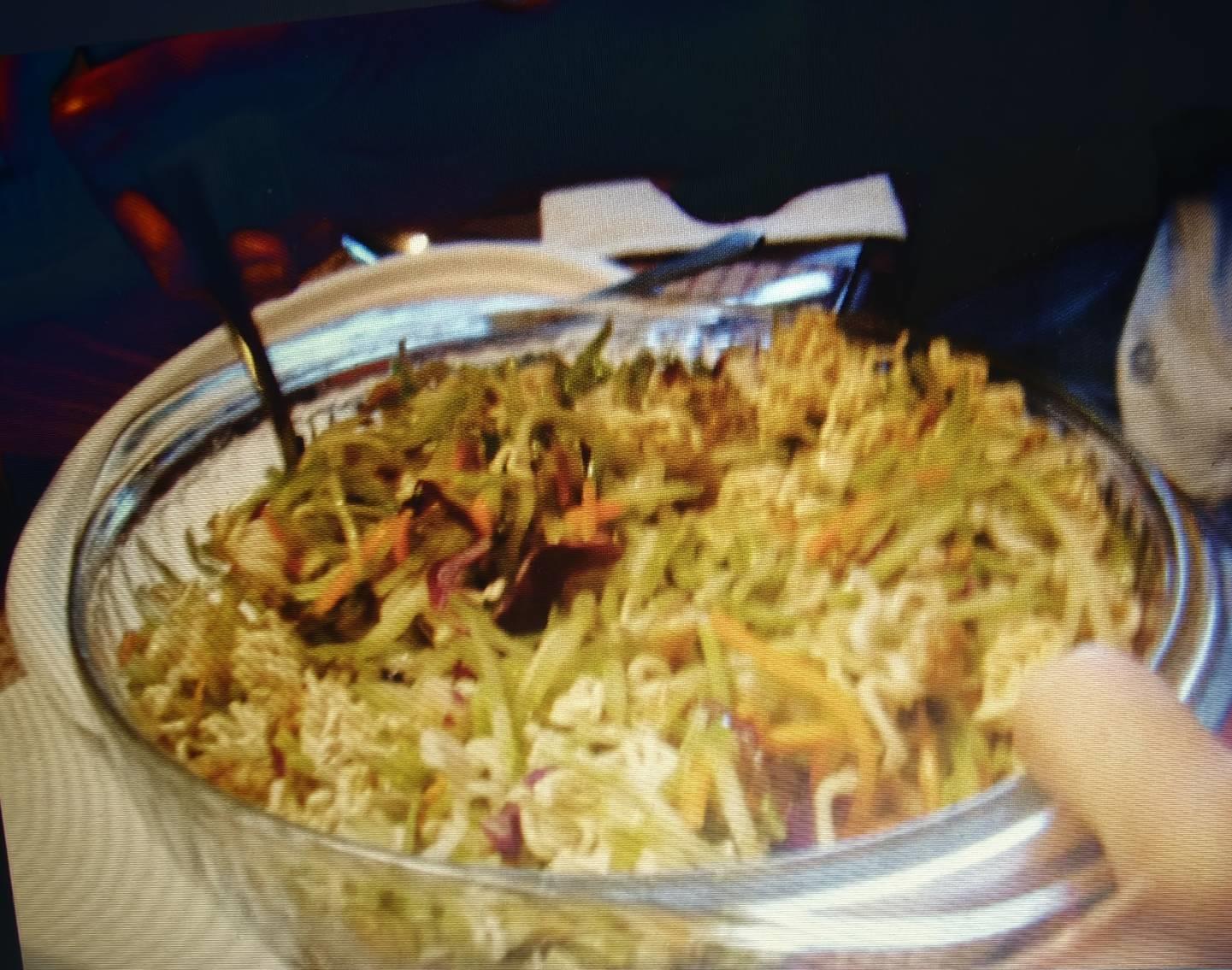 A bowl of food with a fork