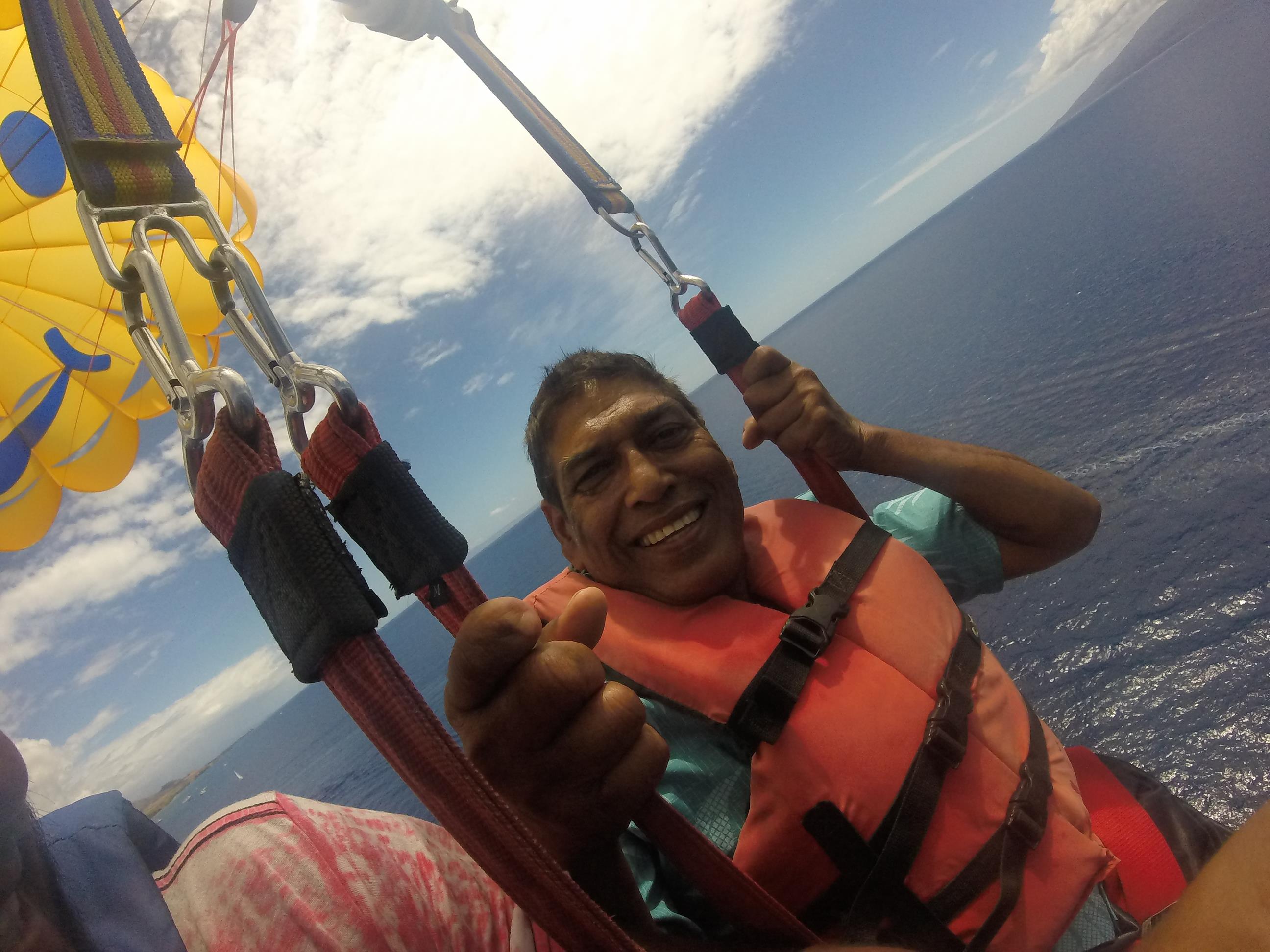 A man in a life jacket on a boat