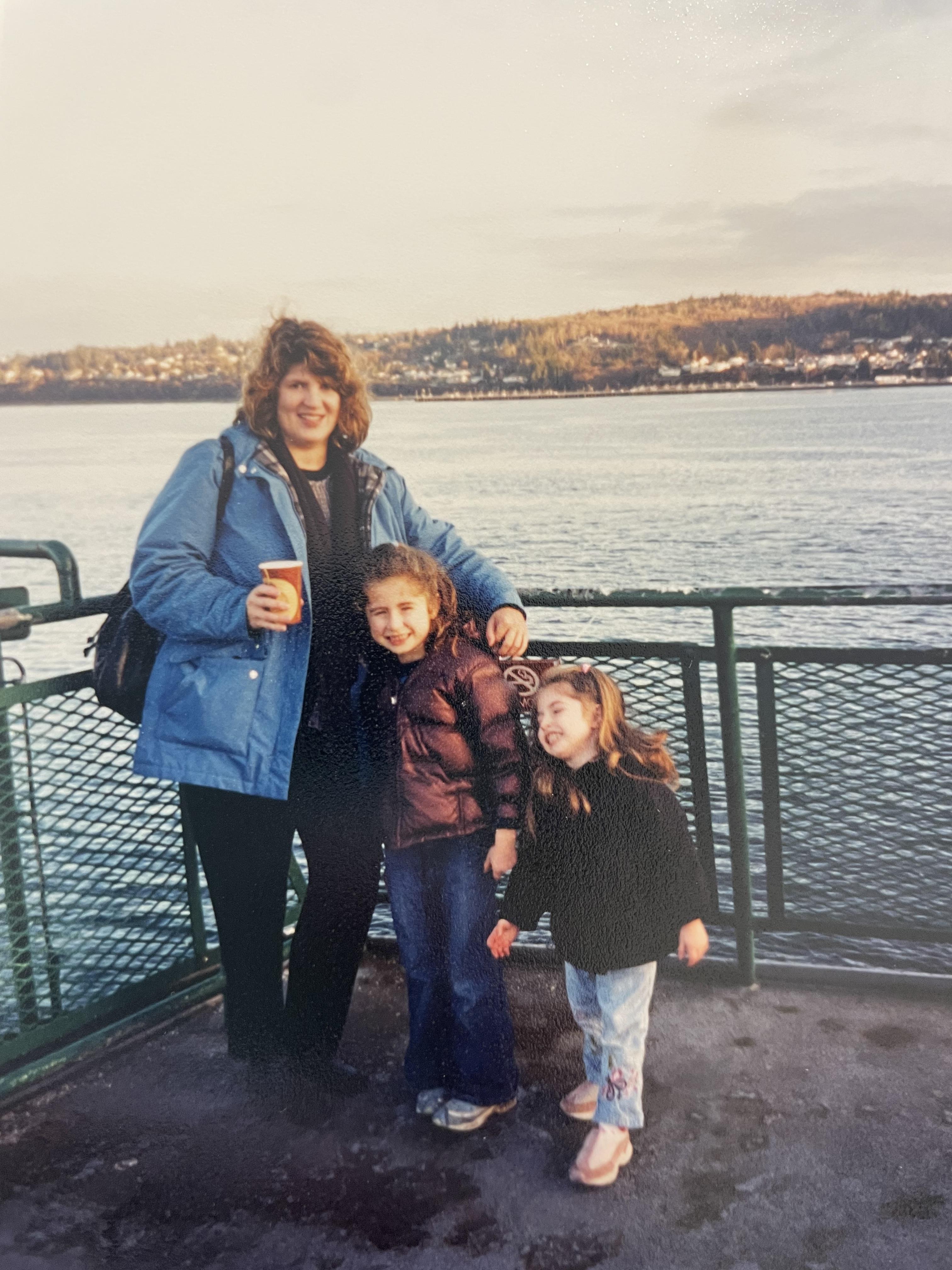 A woman and two girls posing for a picture