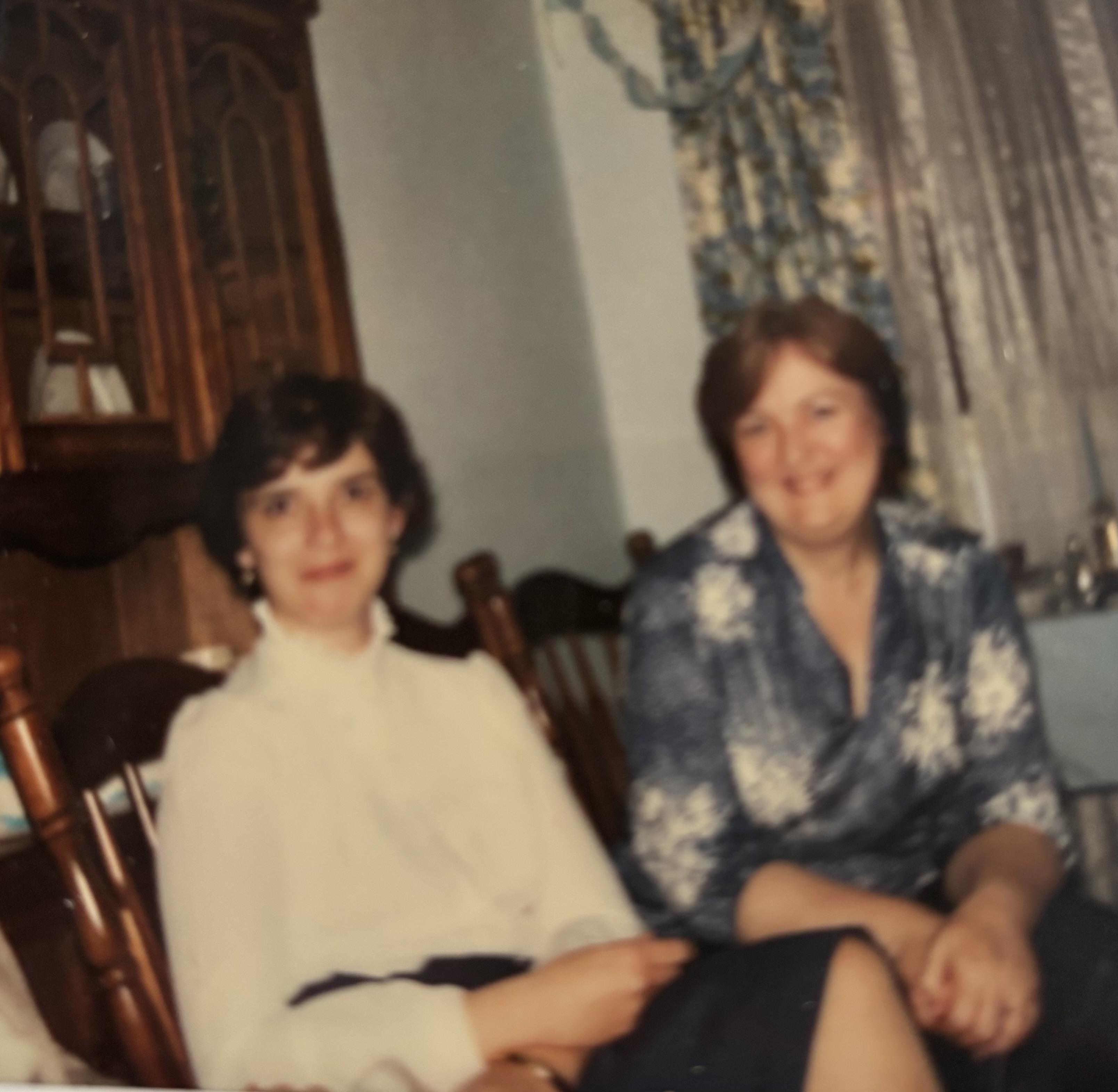 Two women sitting in chairs