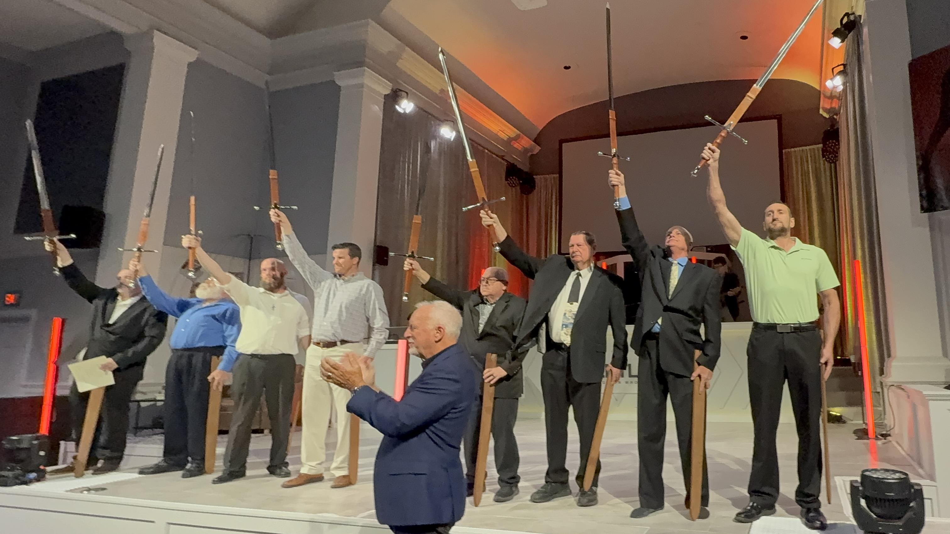 A group of men holding swords