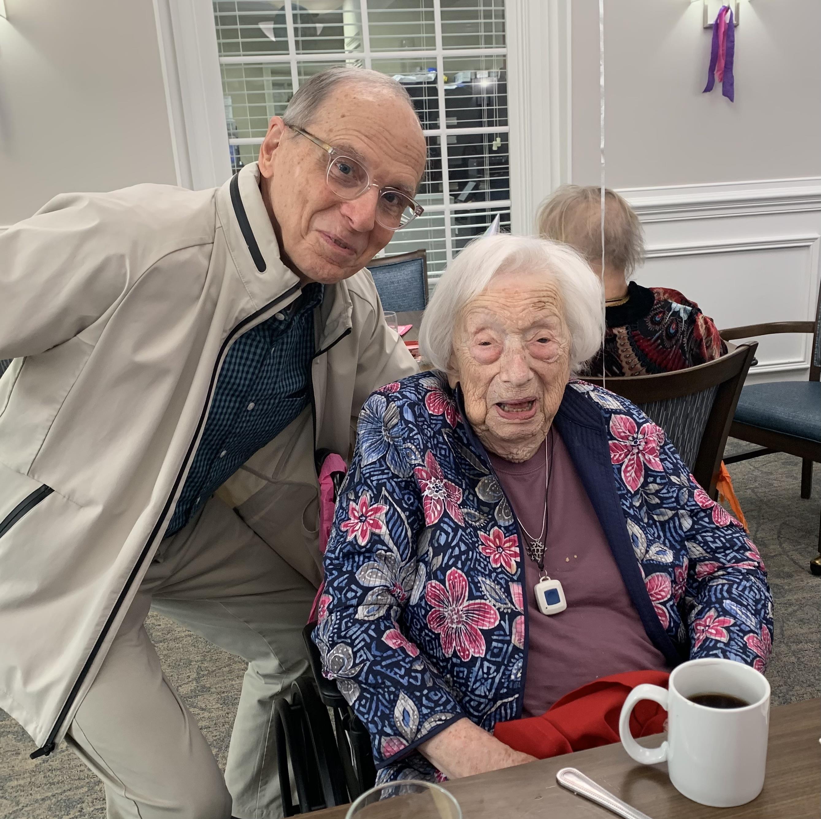 A man and woman posing for a picture