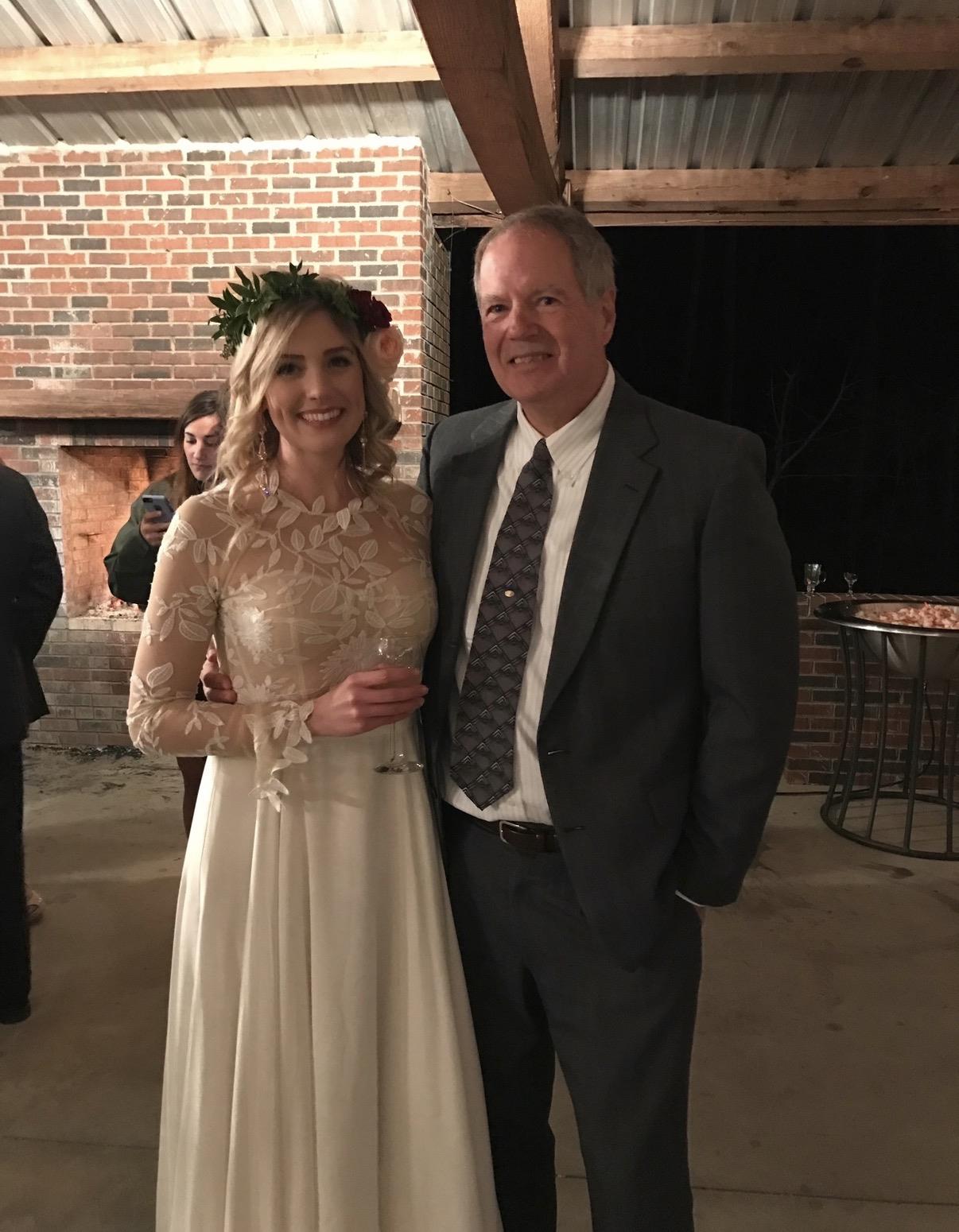 A man and woman posing for a picture