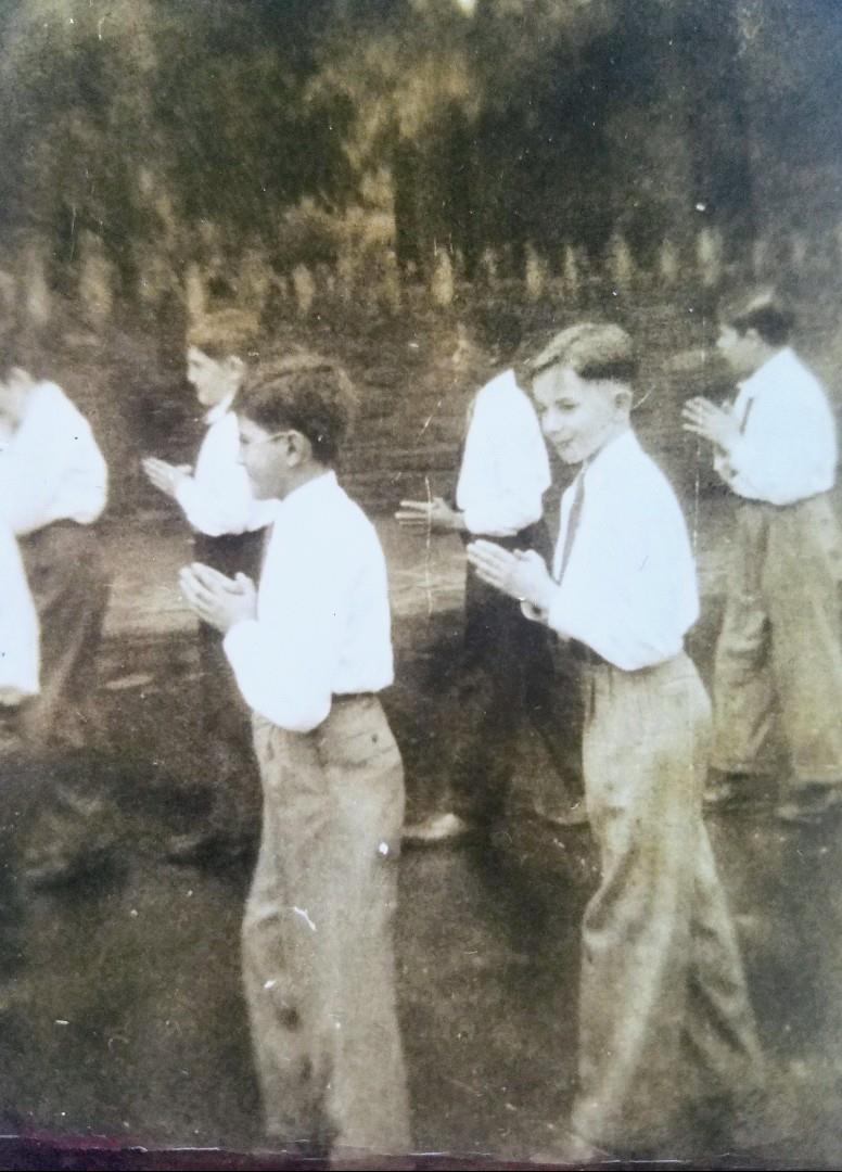 A group of boys standing in a line