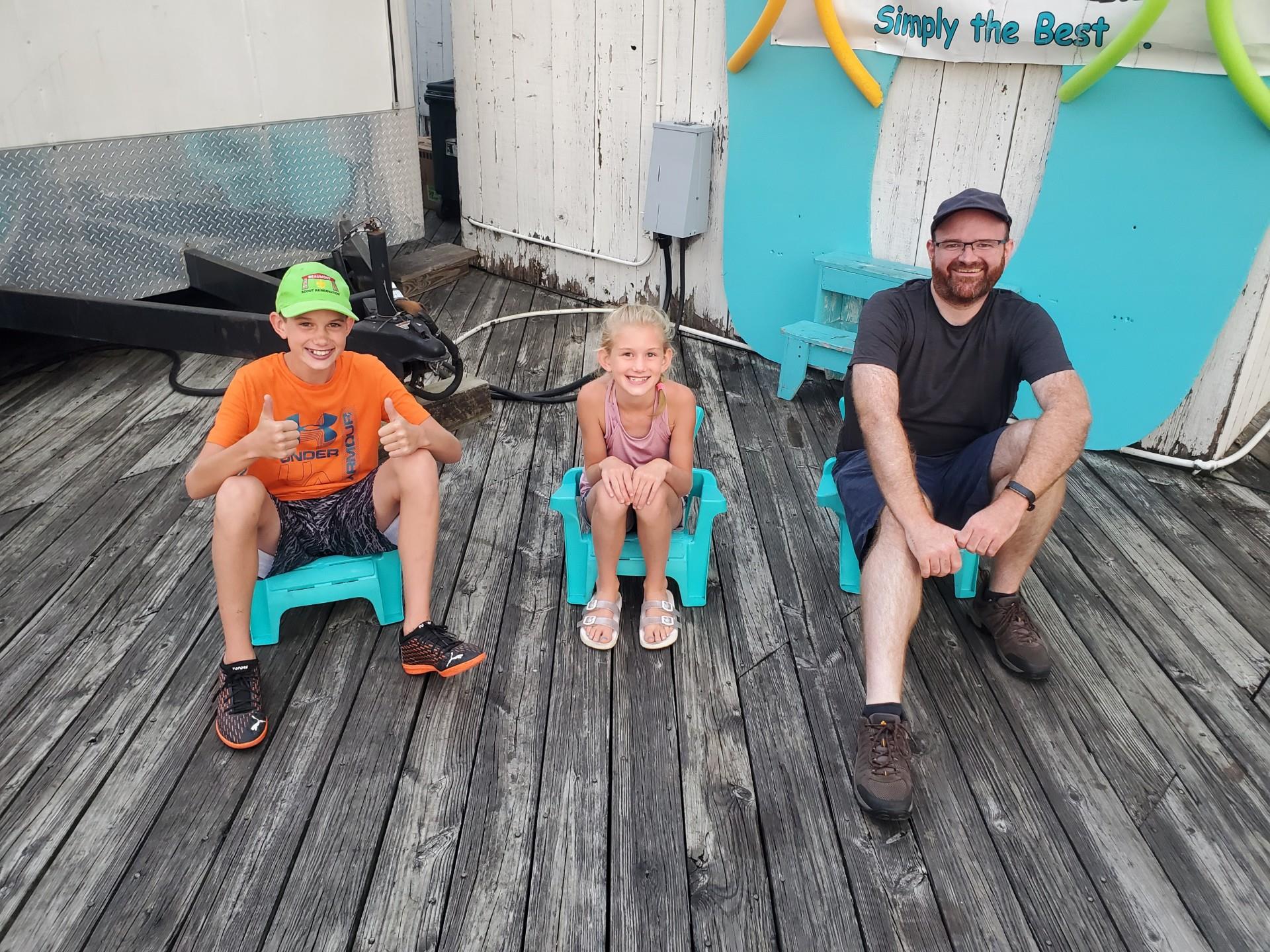 A group of people sitting on chairs