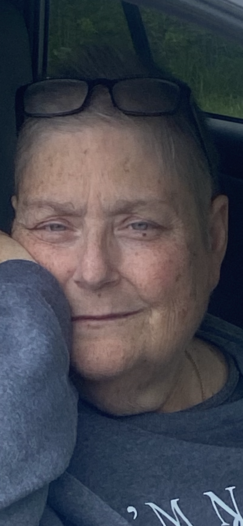A woman with her hand on her chin