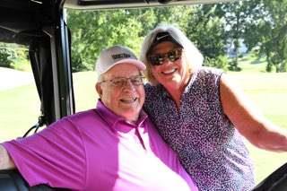 A man and woman smiling for a picture