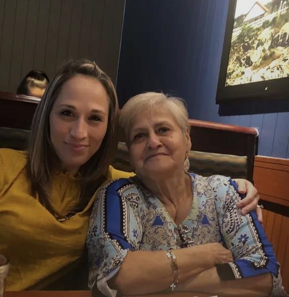 Two women sitting together smiling