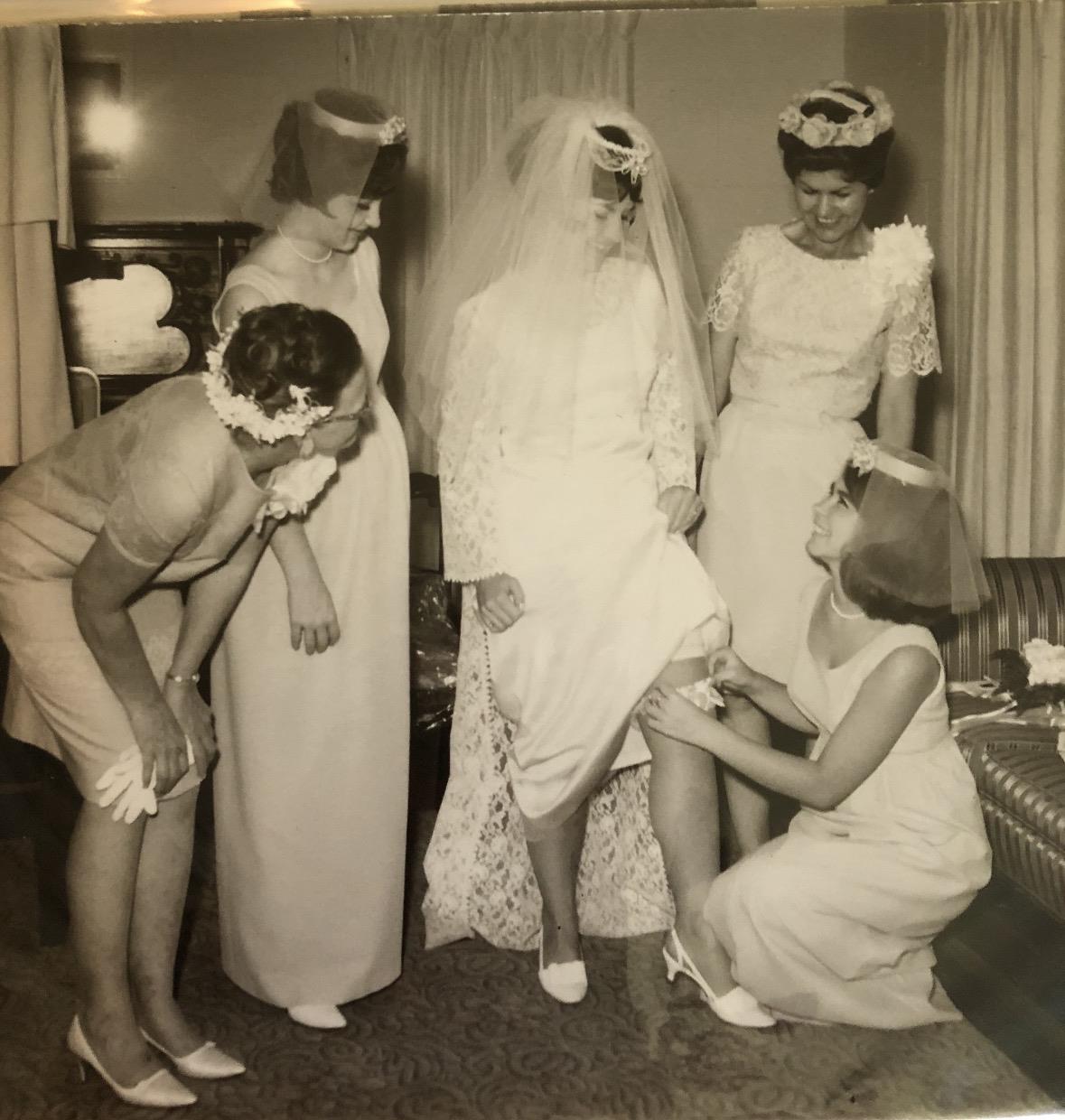 A group of women wearing wedding dresses