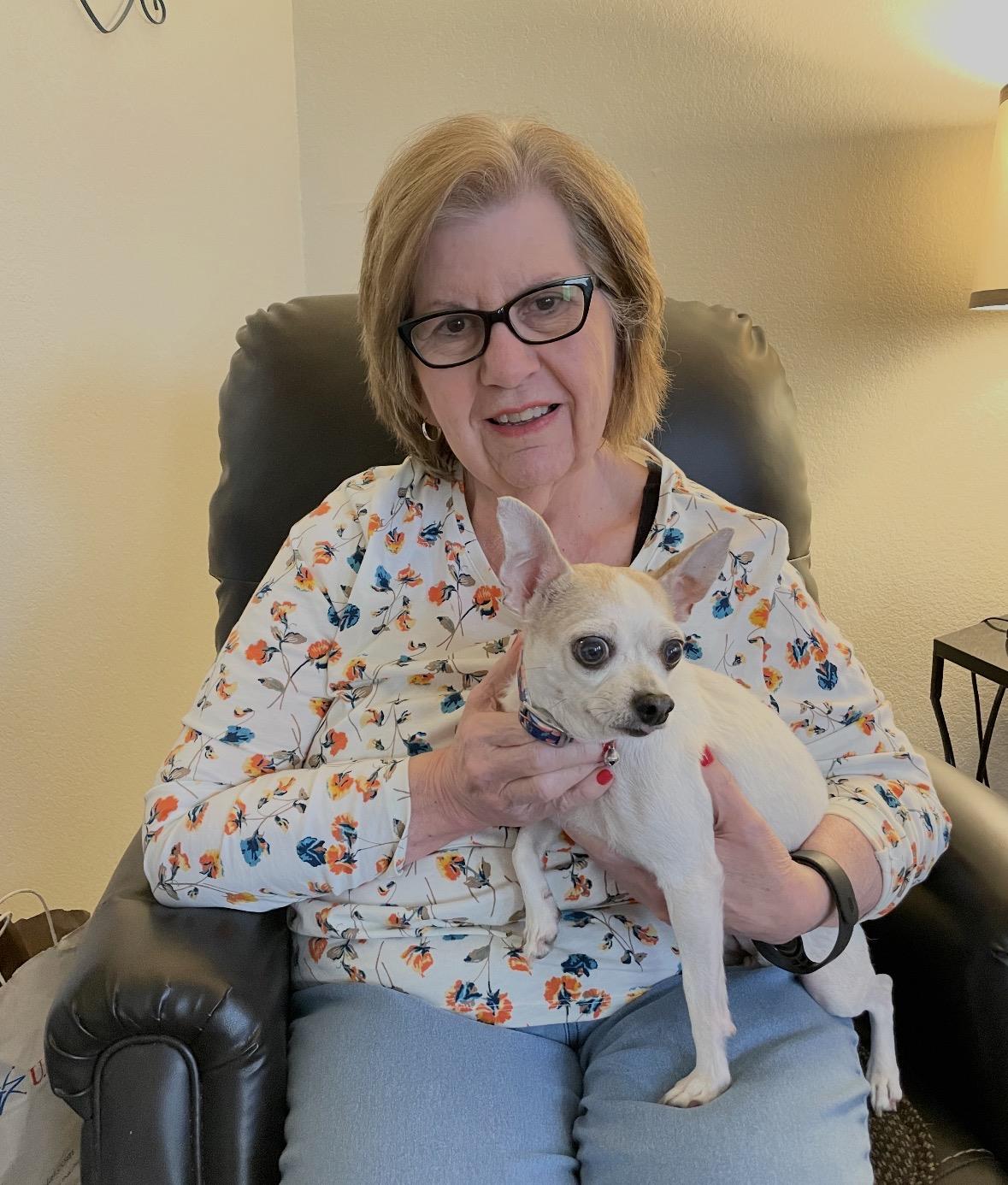 A woman holding a dog