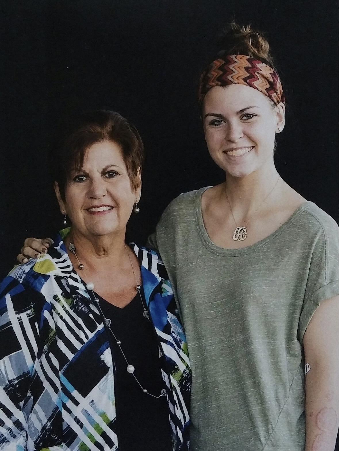 A woman and a woman posing for a picture