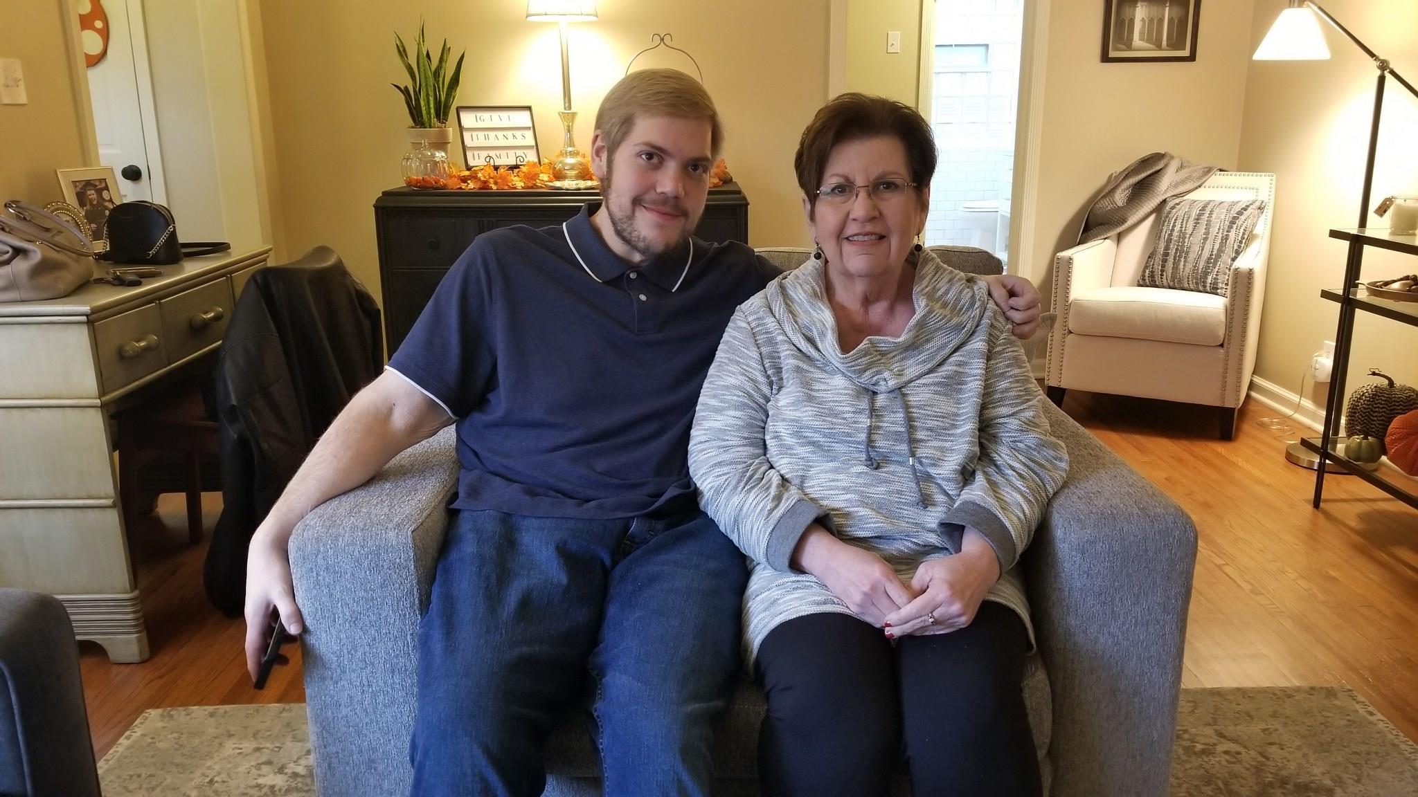 A man and woman sitting on a couch