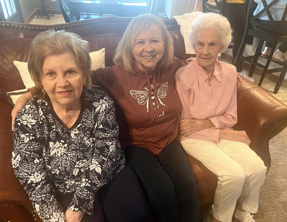 A group of women sitting on a couch