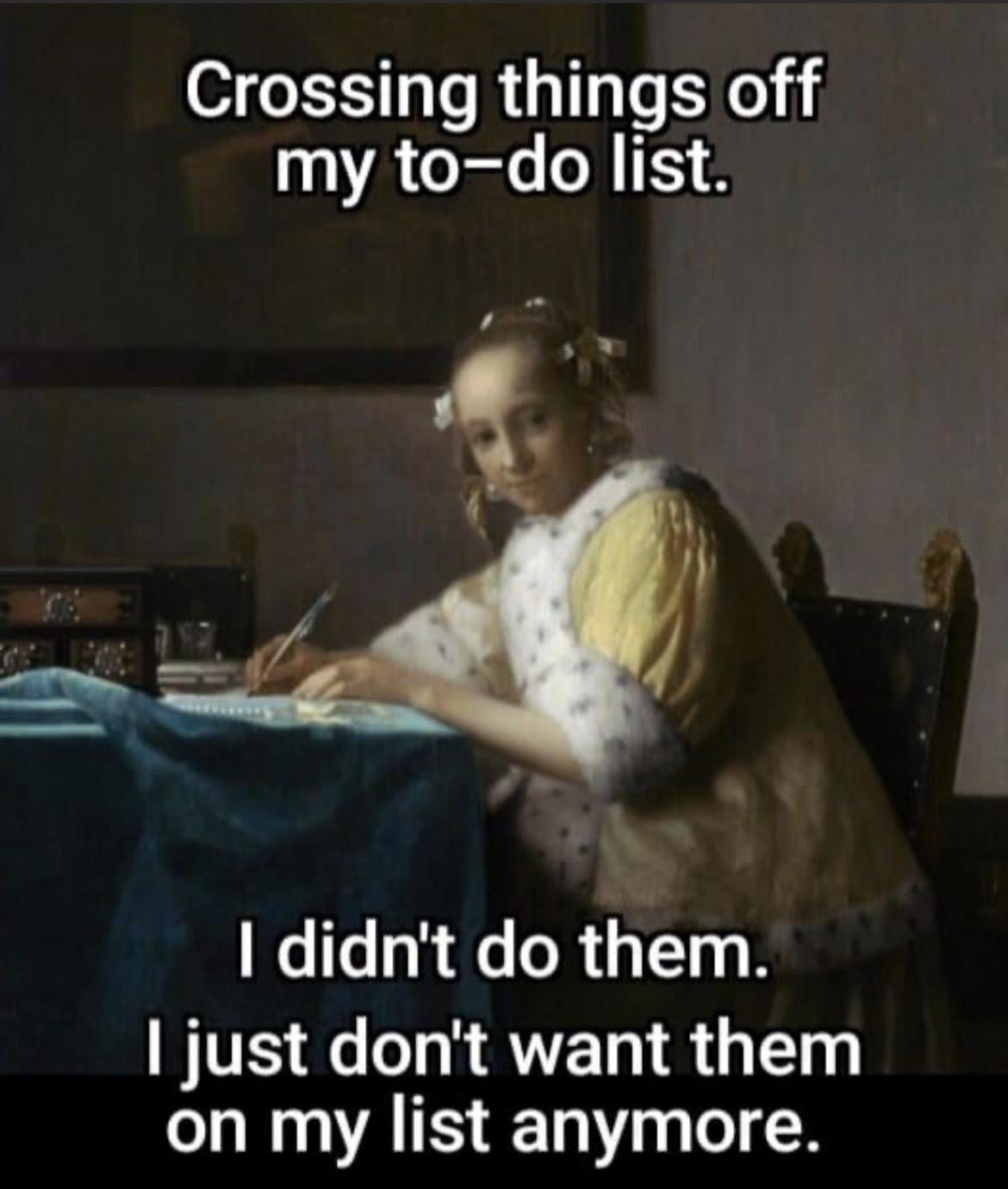 A woman sitting at a table writing
